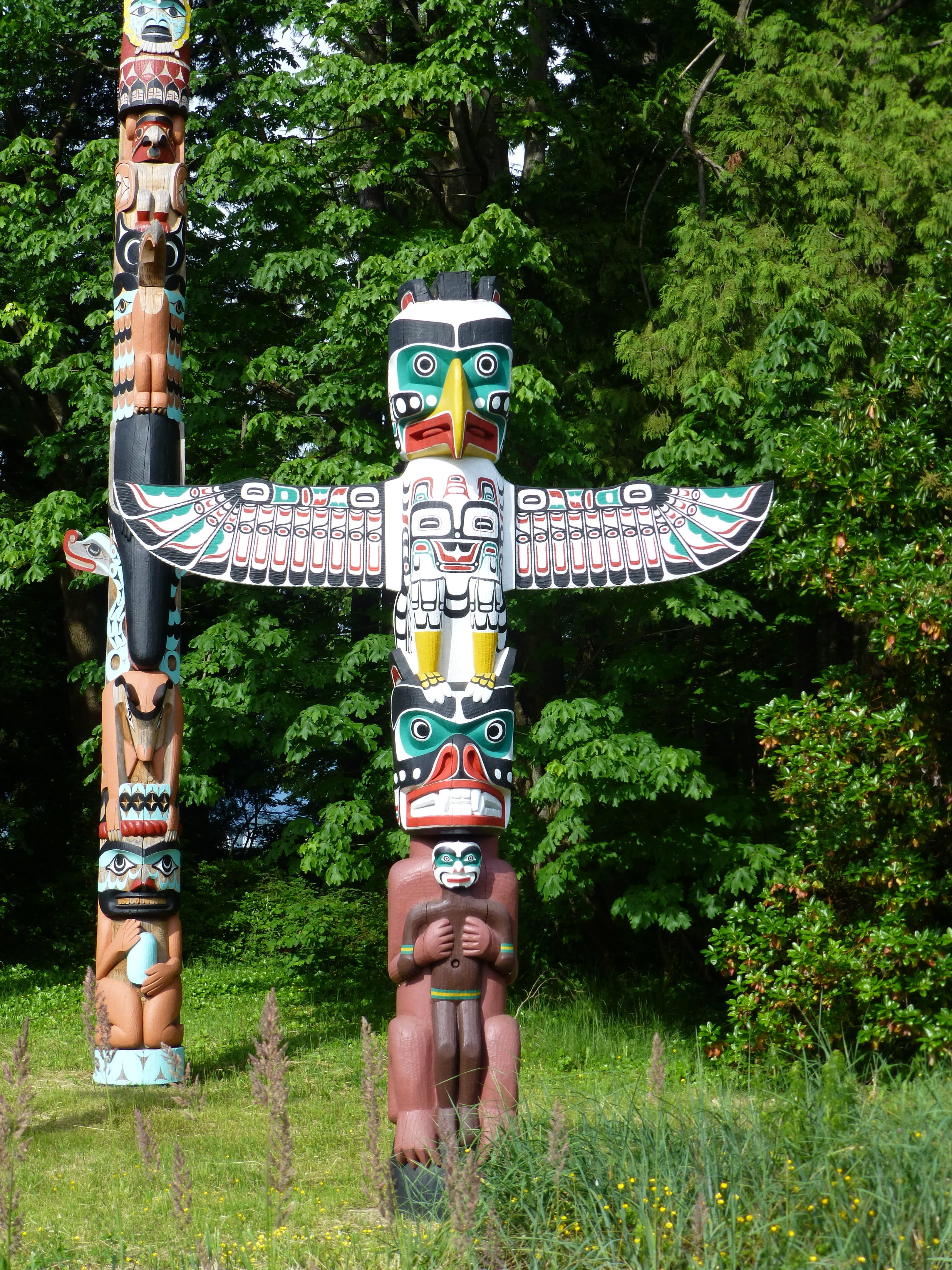 wood carving, alaska, grass, green color, figurine, growth, sculpture, day, nature, tree, statue, creativity, field, no people, plant, poles, forest, art and craft, Phone HD Wallpaper