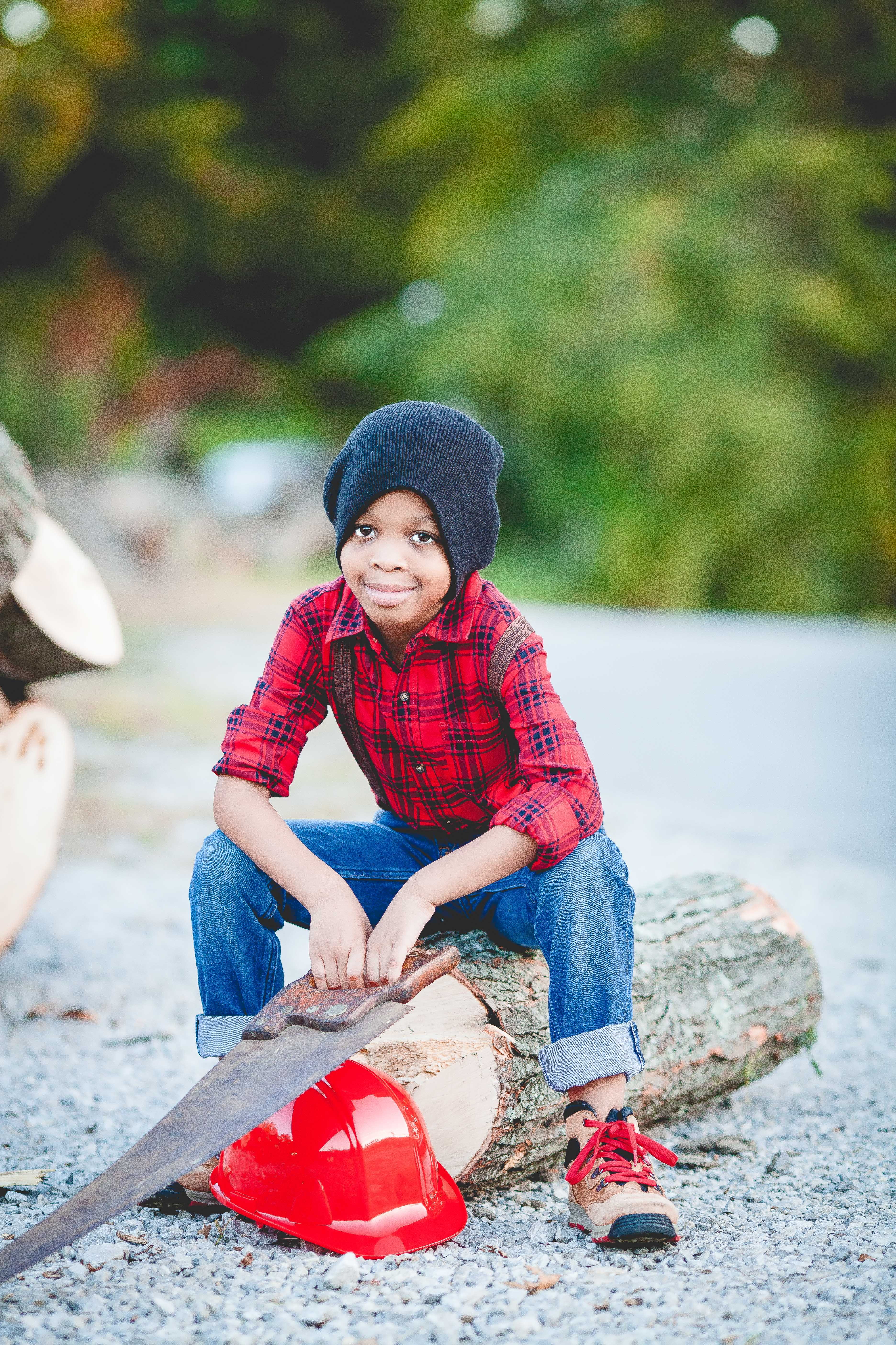 plaid, day, hat, child, front view, log, one person, hand, focus on foreground, young adult, hard, sitting, clothing, 5K, handsaw, boy, childhood, saw, Phone HD Wallpaper
