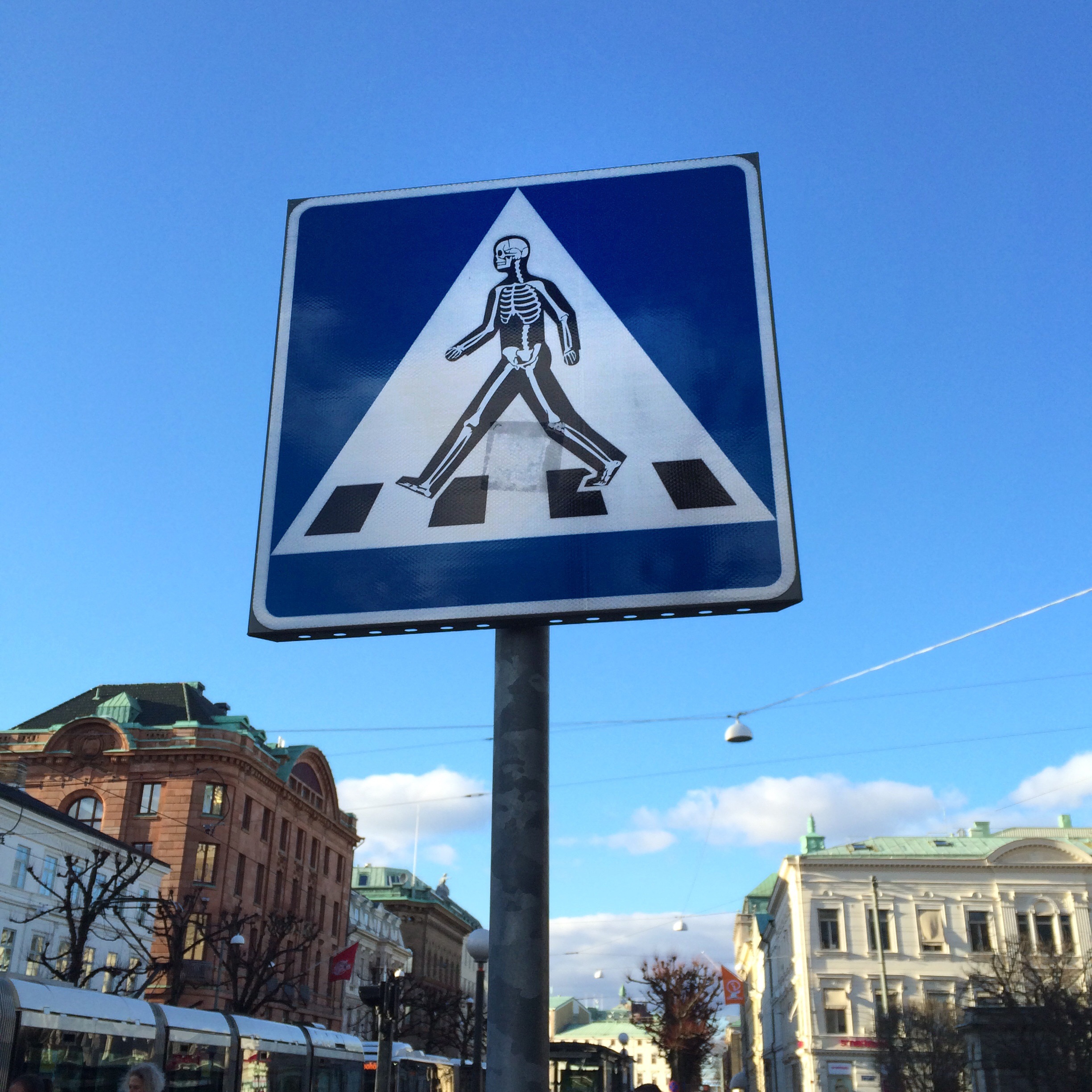 1080P, building exterior, human representation, communication, day, sticker, blue, pedestrian crossing, building, street, outdoors, guidance, sky, sign, Phone HD Wallpaper