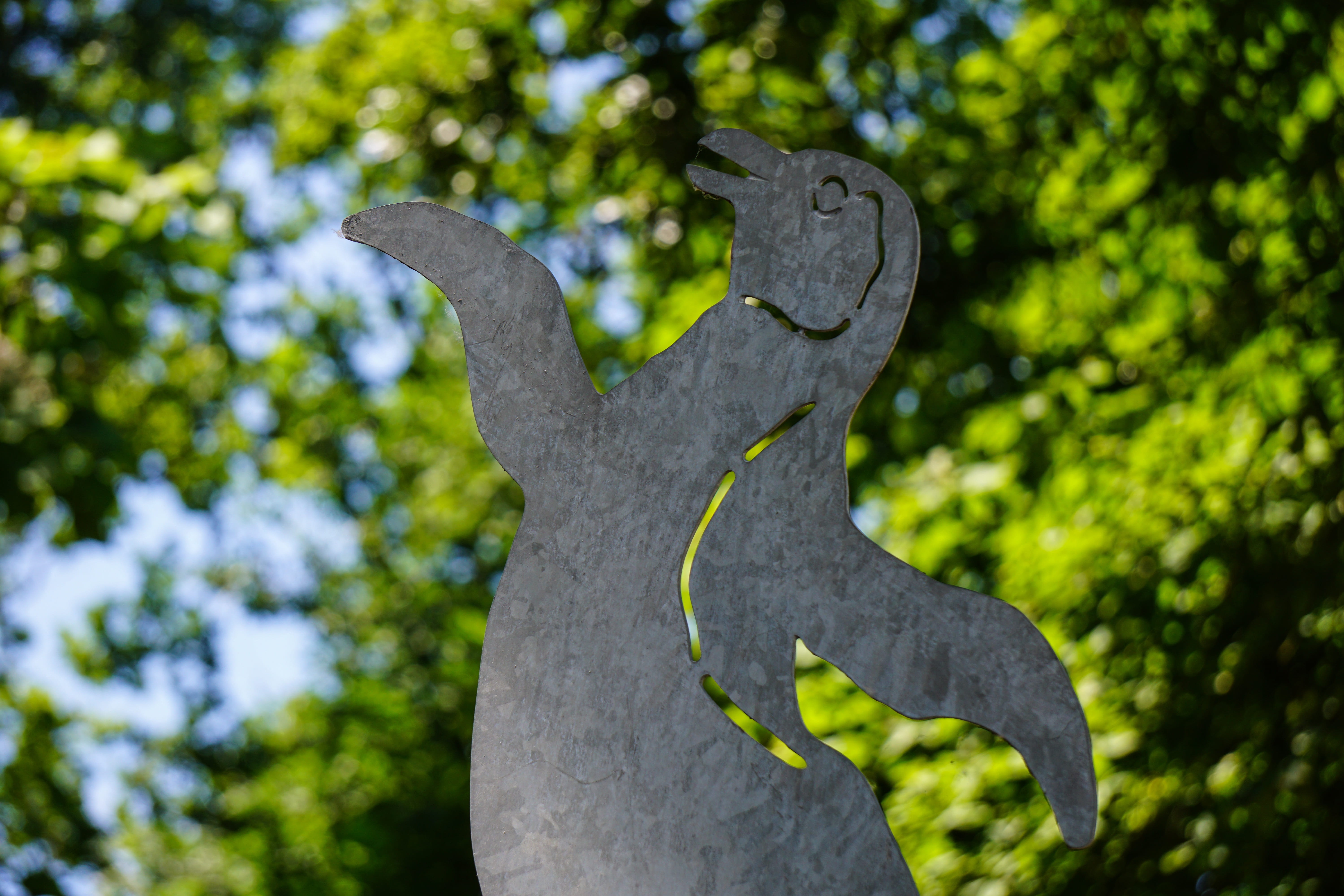leaves, emotion, green color, outdoors, Penguin, animal themes, animal, low angle view, animal representation, sculpture, tree, out of focus, day, Trees, HD Wallpaper