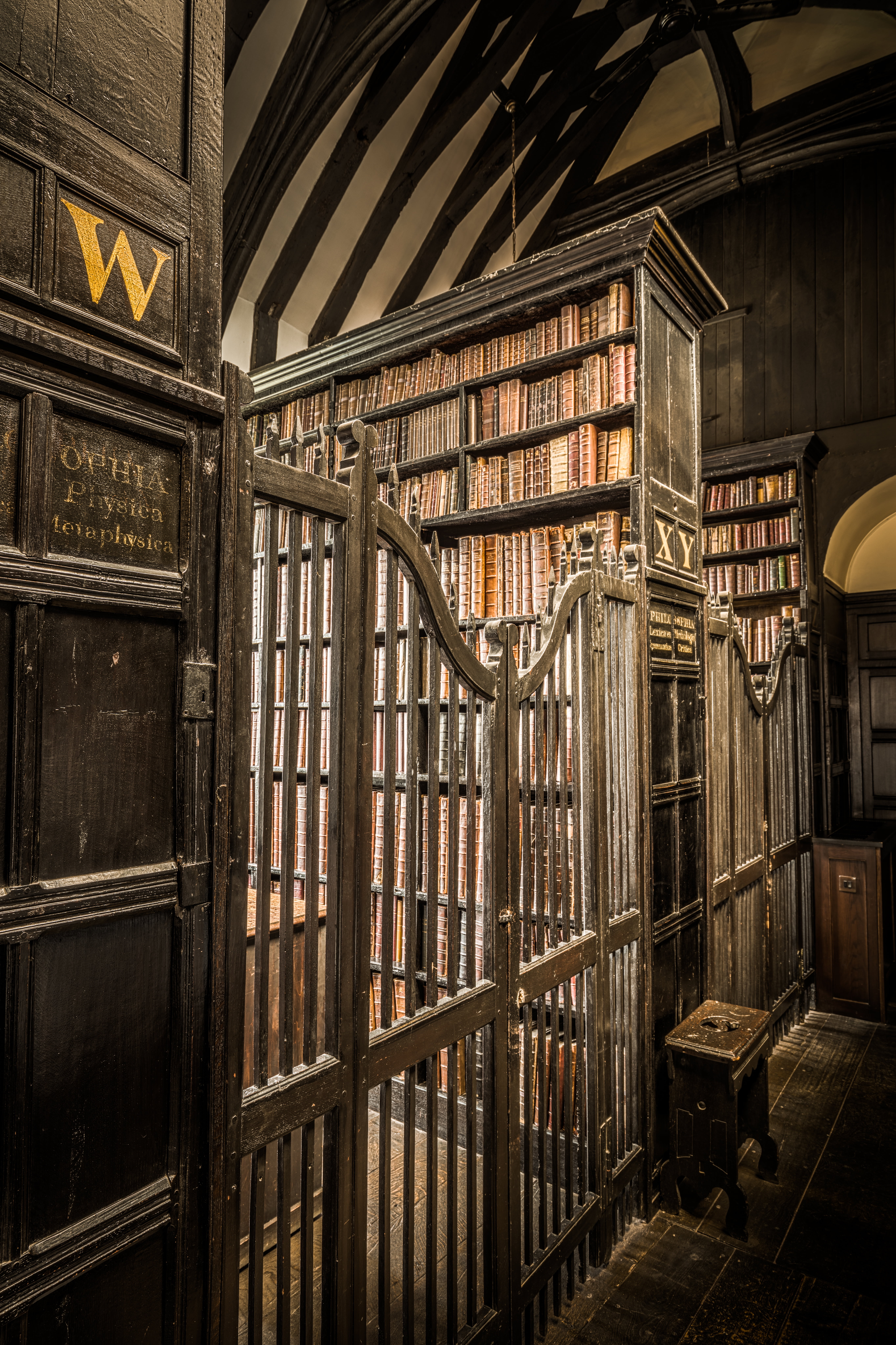 indoors, ceiling, book, chair, wooden, no people, 8K, text, gate, wall, safety, inside, architecture, photo, library, infrastructure, bookcases, shelf, Phone HD Wallpaper