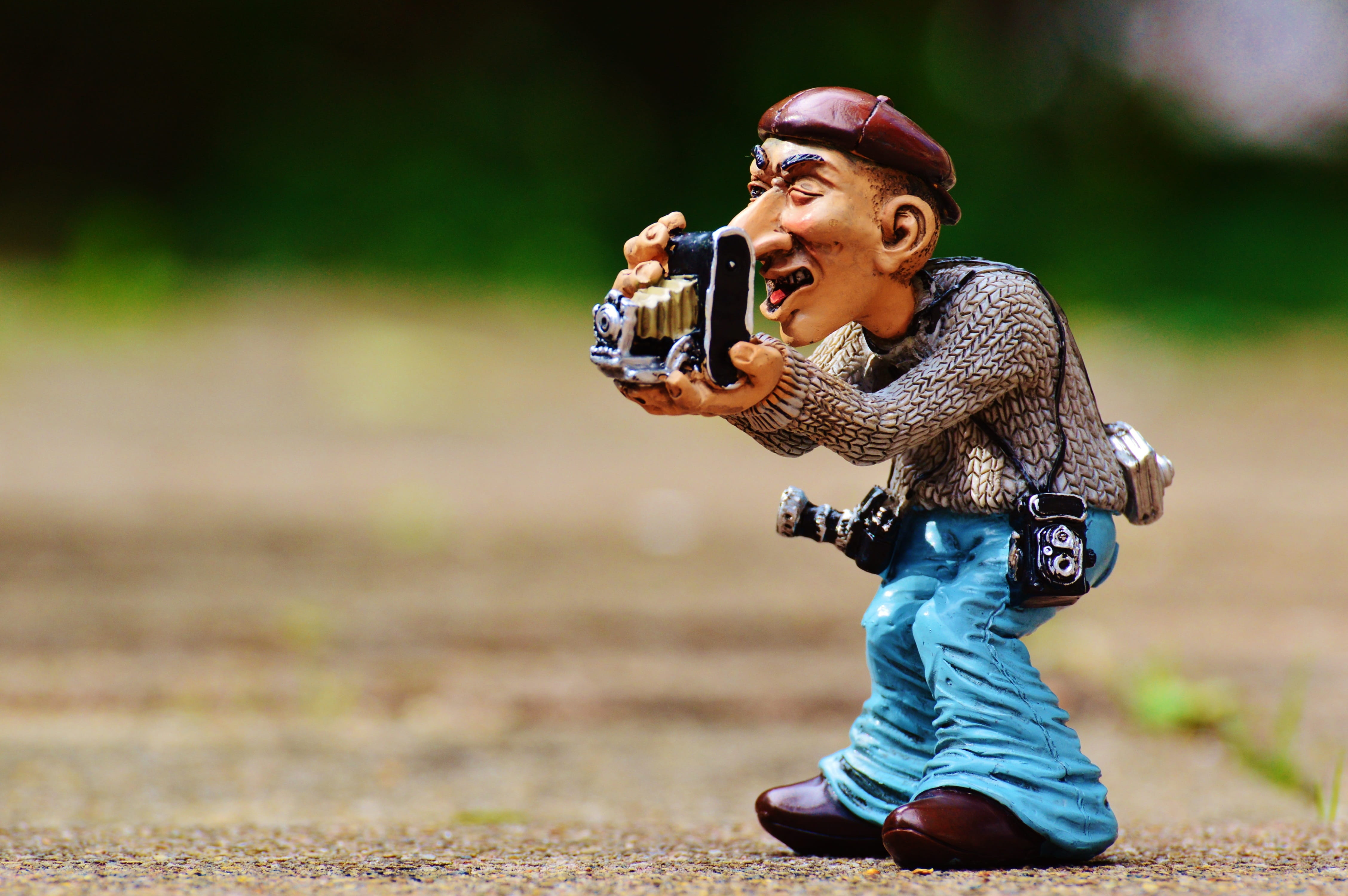 photo tourists, man, figurine, photography, focus on foreground, full length, holding, leisure activity, funny, warm clothing, real people, folding camera, HD Wallpaper