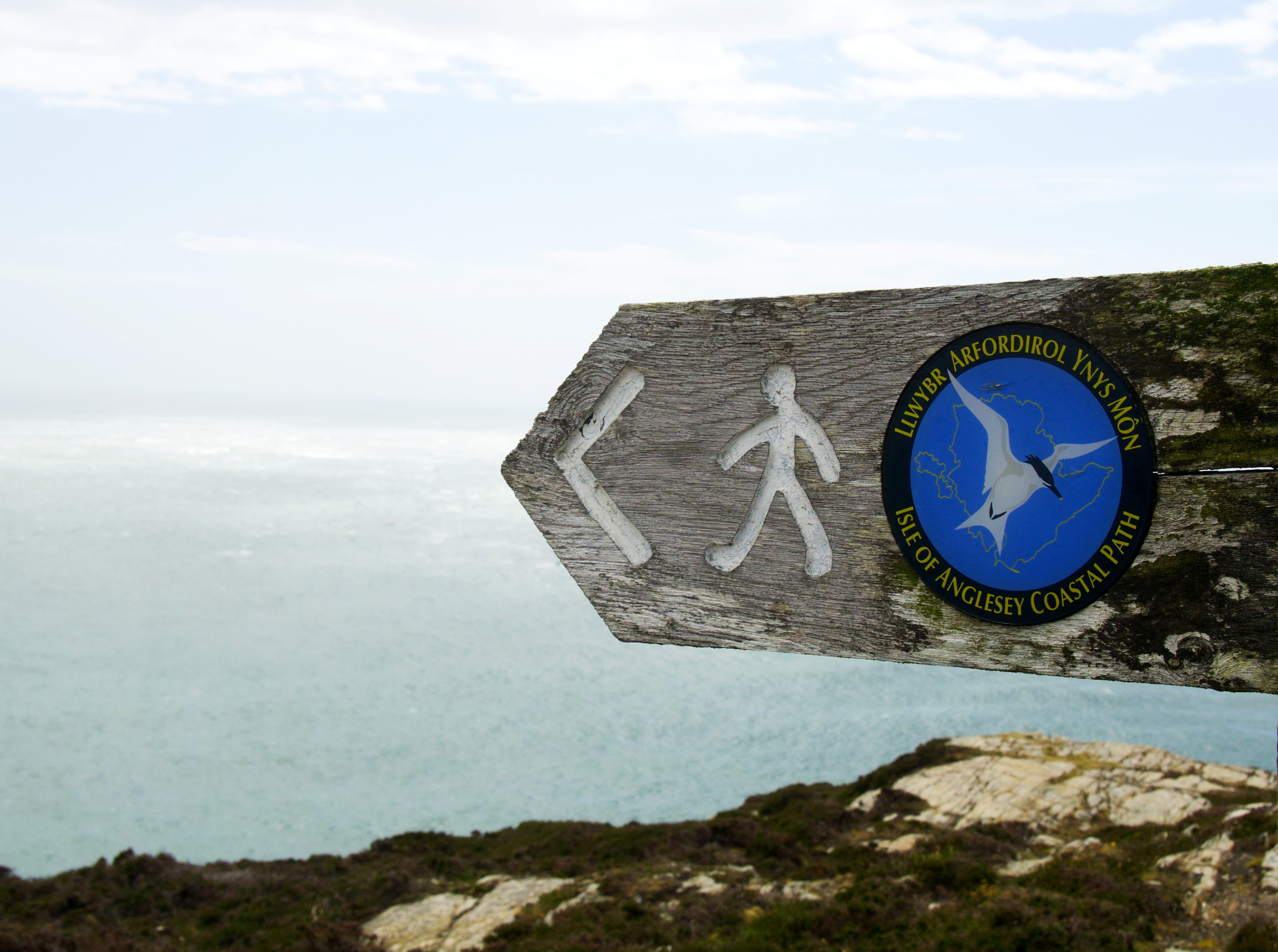 cloud - sky, anglesey, tranquil scene, sea, united kingdom, sky, 4K, day, sign, guidance, blue, worn sign, clock, direction, outdoors, water, non-urban scene, HD Wallpaper