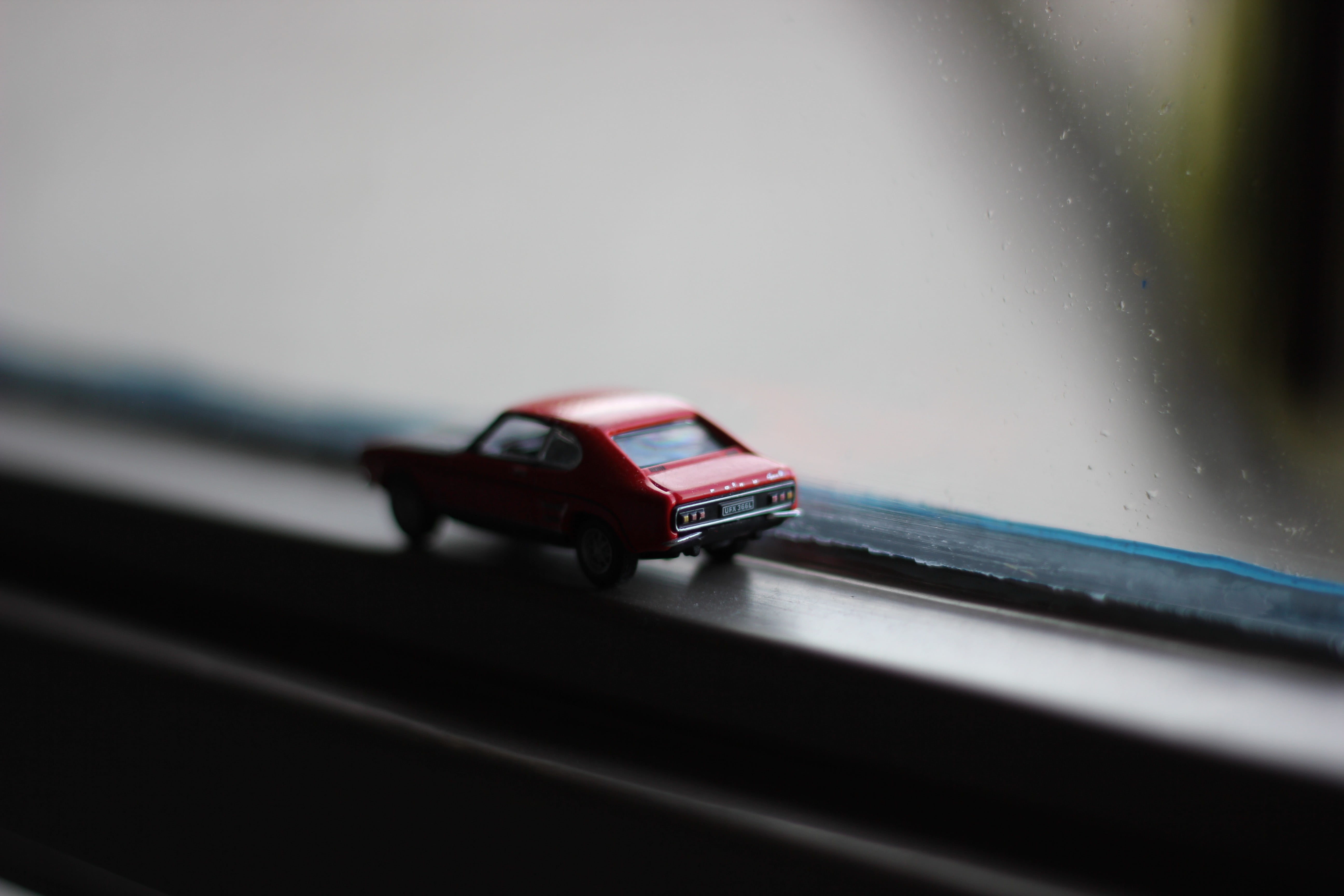 black, vehicle interior, transportation, plastic, macro, toy car, toy, indoors, close-up, wet, mode of transportation, motor vehicle, road, travel, 5K, HD Wallpaper
