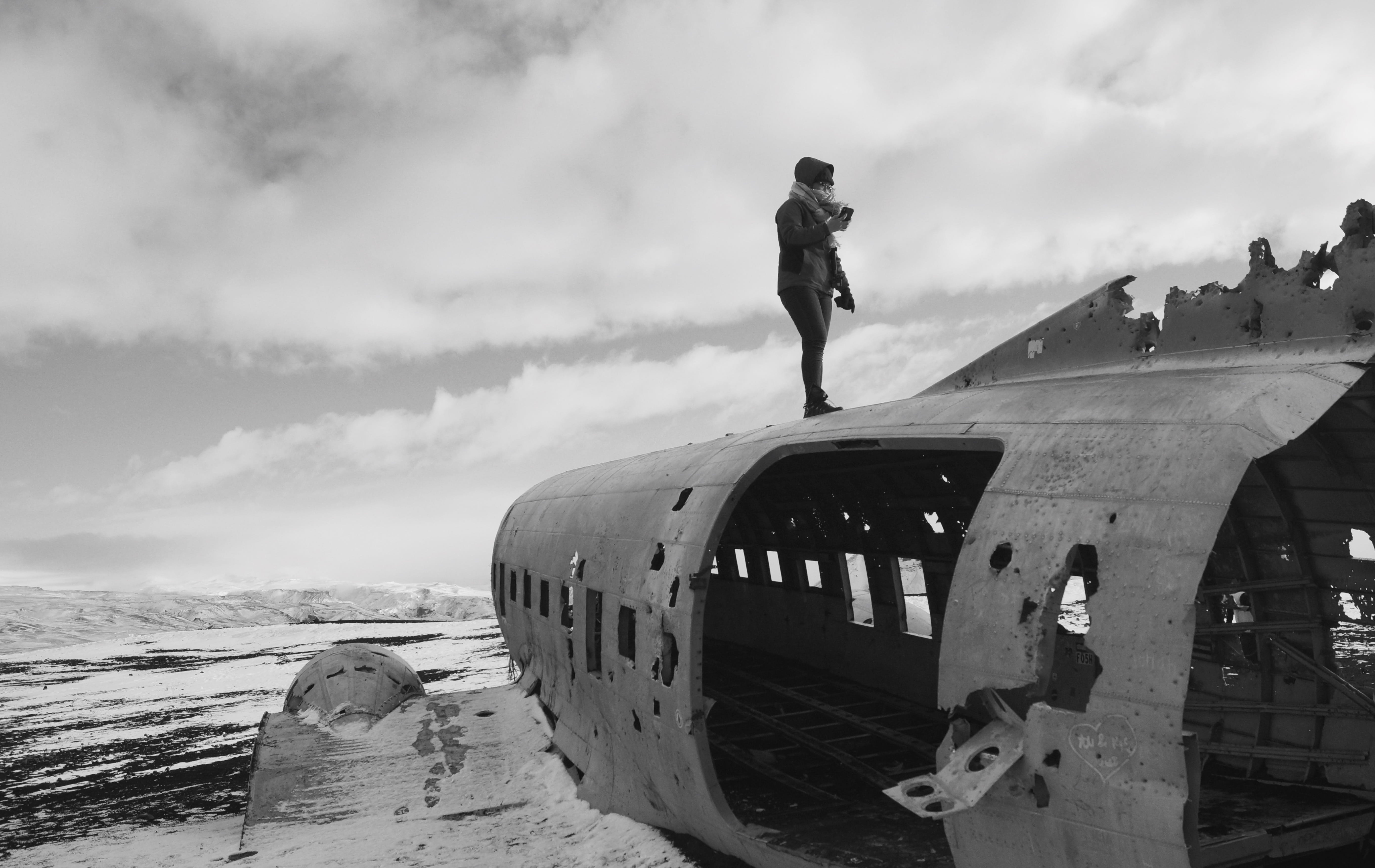 travelling, plane, apparel, outdoors, iceland, vehicle, lifestyles, air vehicle, aircraft, black and white, sky, real people, crash site, winter, airplane, HD Wallpaper