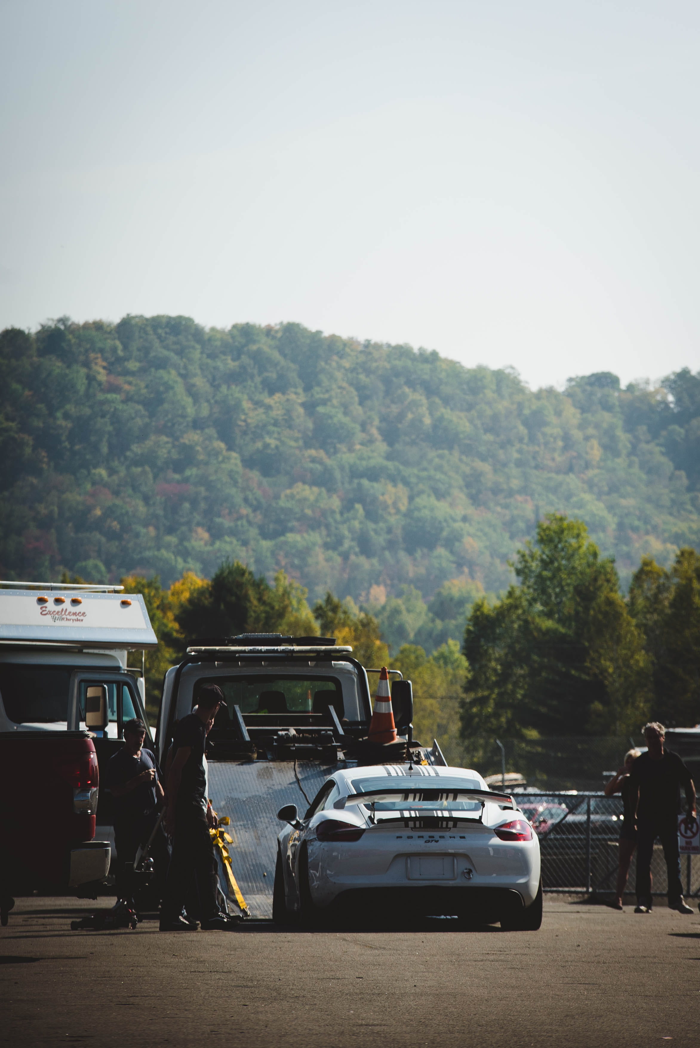 real people, porsche, mountain, day, stationary, circuit, tower, towing, people, plant, race team, motor vehicle, wheel, clear sky, team, extreme, group of people, Phone HD Wallpaper