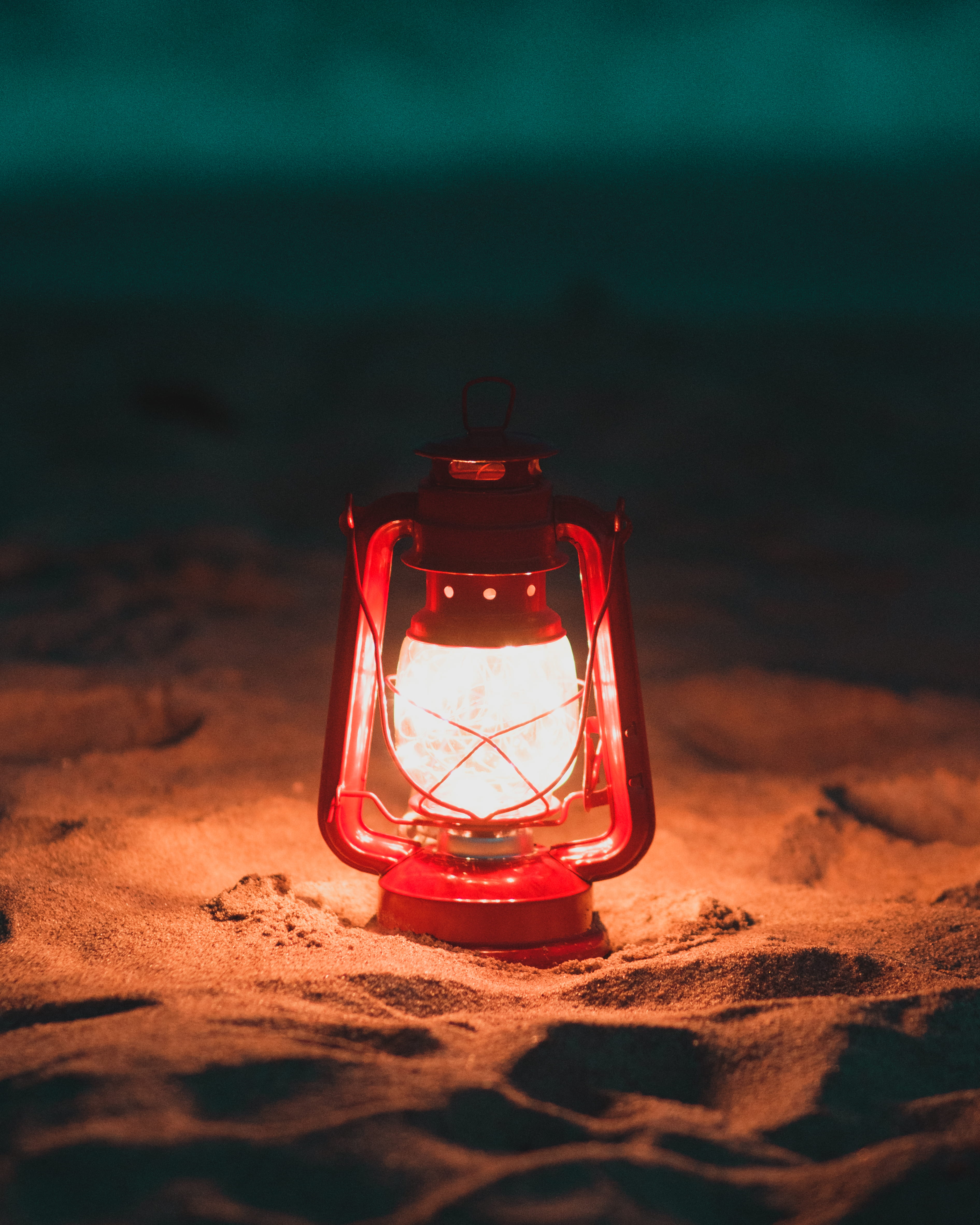 glass - material, land, glass items, still life, night, lighted, light, sand, 4K, selective focus, lamp, red, glass, nature, table, outdoors, turned, transparent, Phone HD Wallpaper