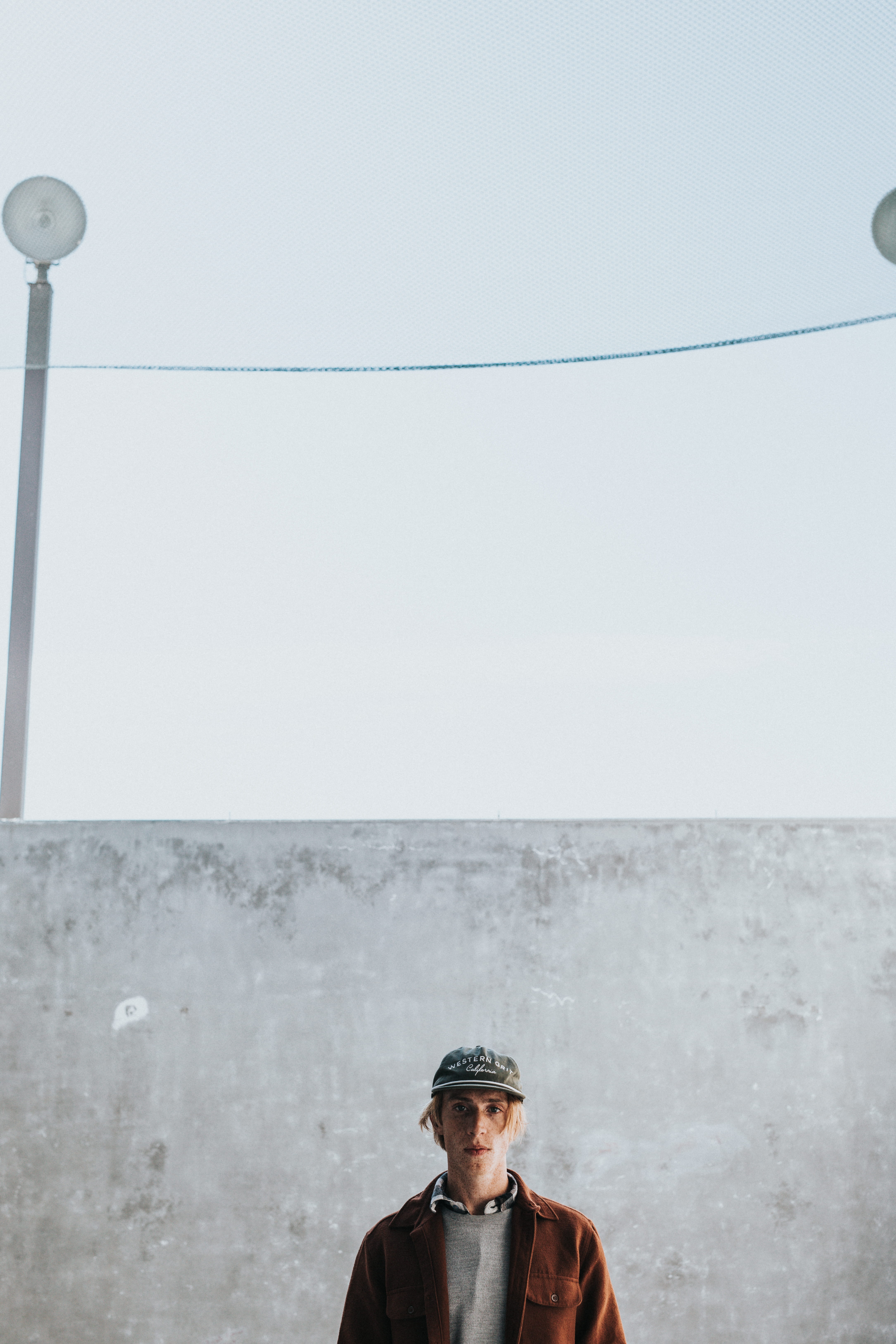adult, architecture, apparel, 5K, day, clear sky, transportation, headshot, light, copy space, banister, leisure activity, sky, overcoat, coat, animal, Phone HD Wallpaper