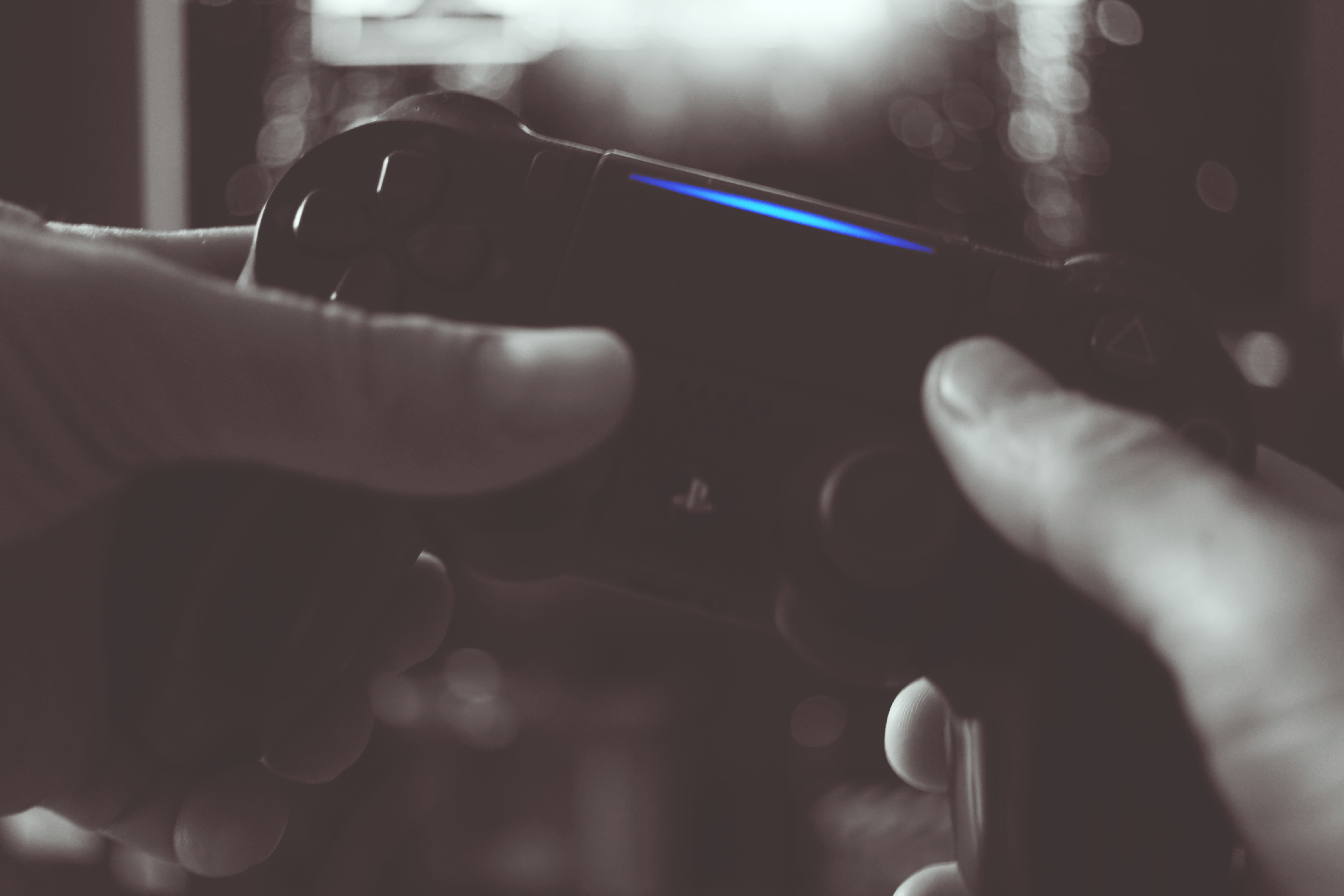 white, controller, lens flare, indoors, game, finger, unrecognizable person, hands, thumbs, close-up, playstation, real people, black, selective focus, HD Wallpaper