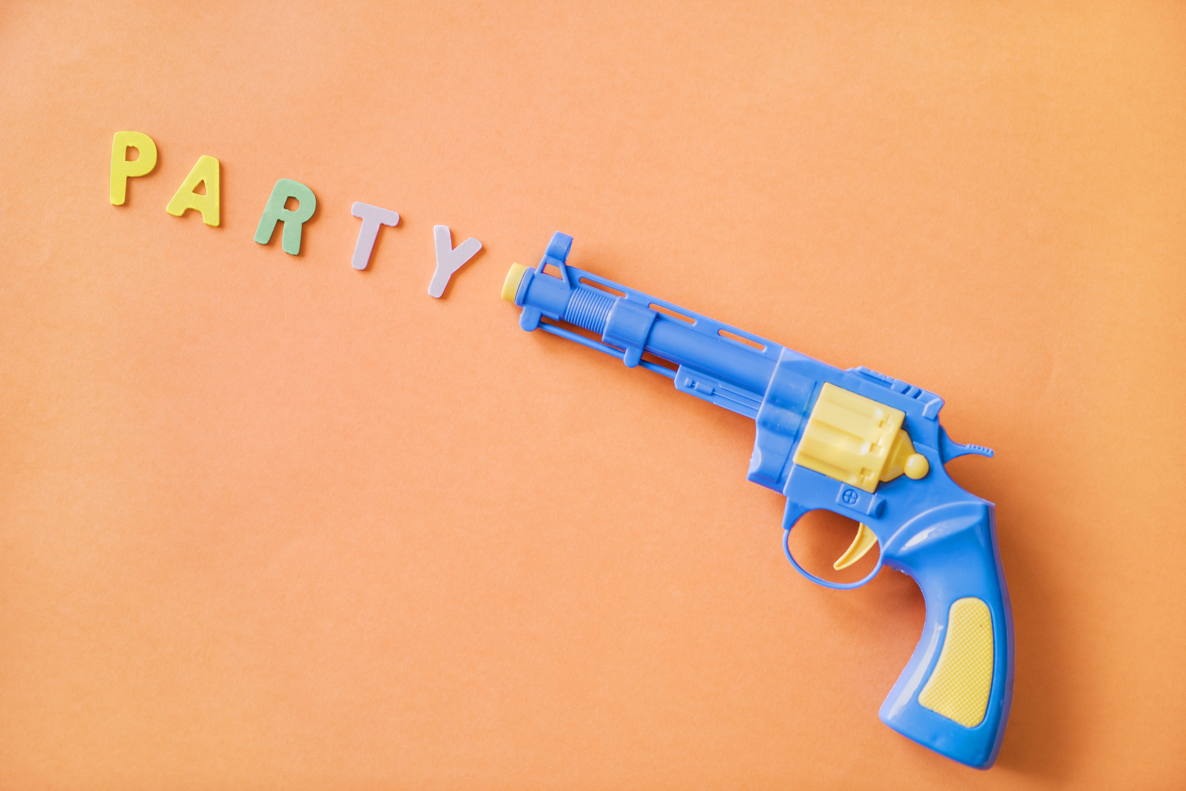 cable, game, pistol, no people, fake, toy, orange background, isolated, large group of objects, copy space, party, joy, handgun, close-up, sport, shoot, HD Wallpaper