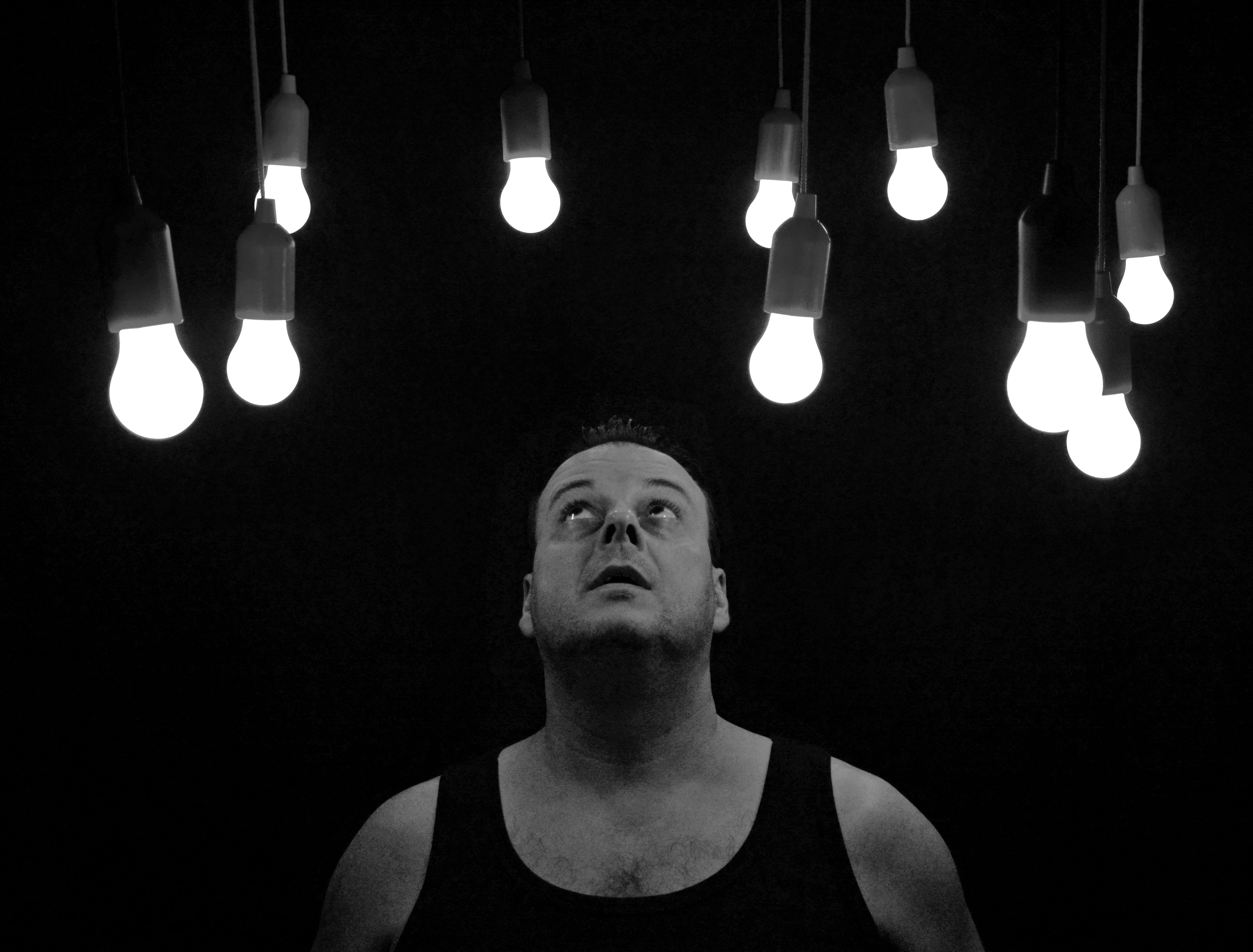 contemplation, studio shot, one person, art, person, power supply, black background, electric lamp, looking up, awakening, low angle view, black-and-white, HD Wallpaper