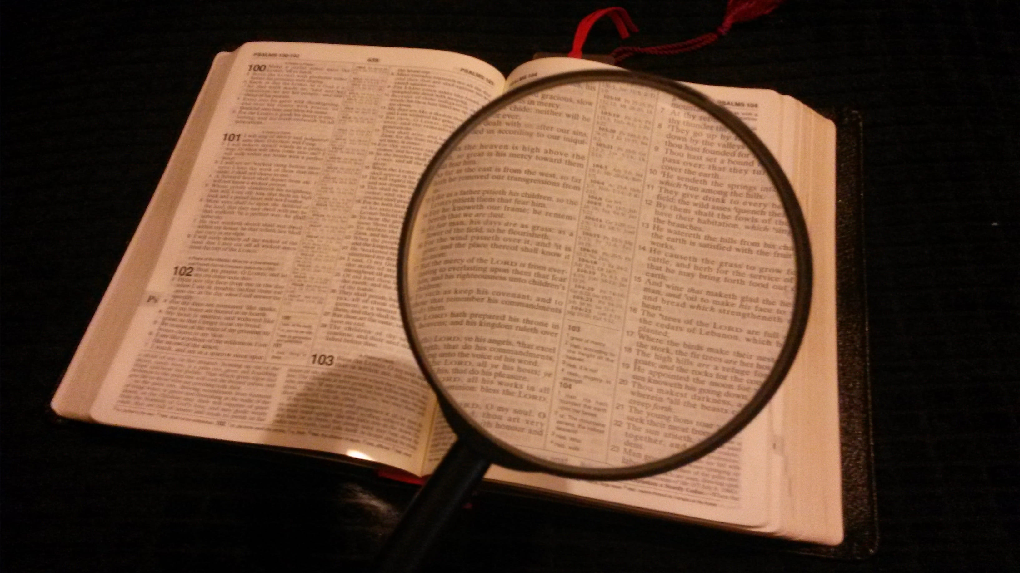 holy, indoors, open, book, holding, studio shot, glass, wood - material, paper, Magnified, magnifying, hardcover book, word of god, research, black background, HD Wallpaper