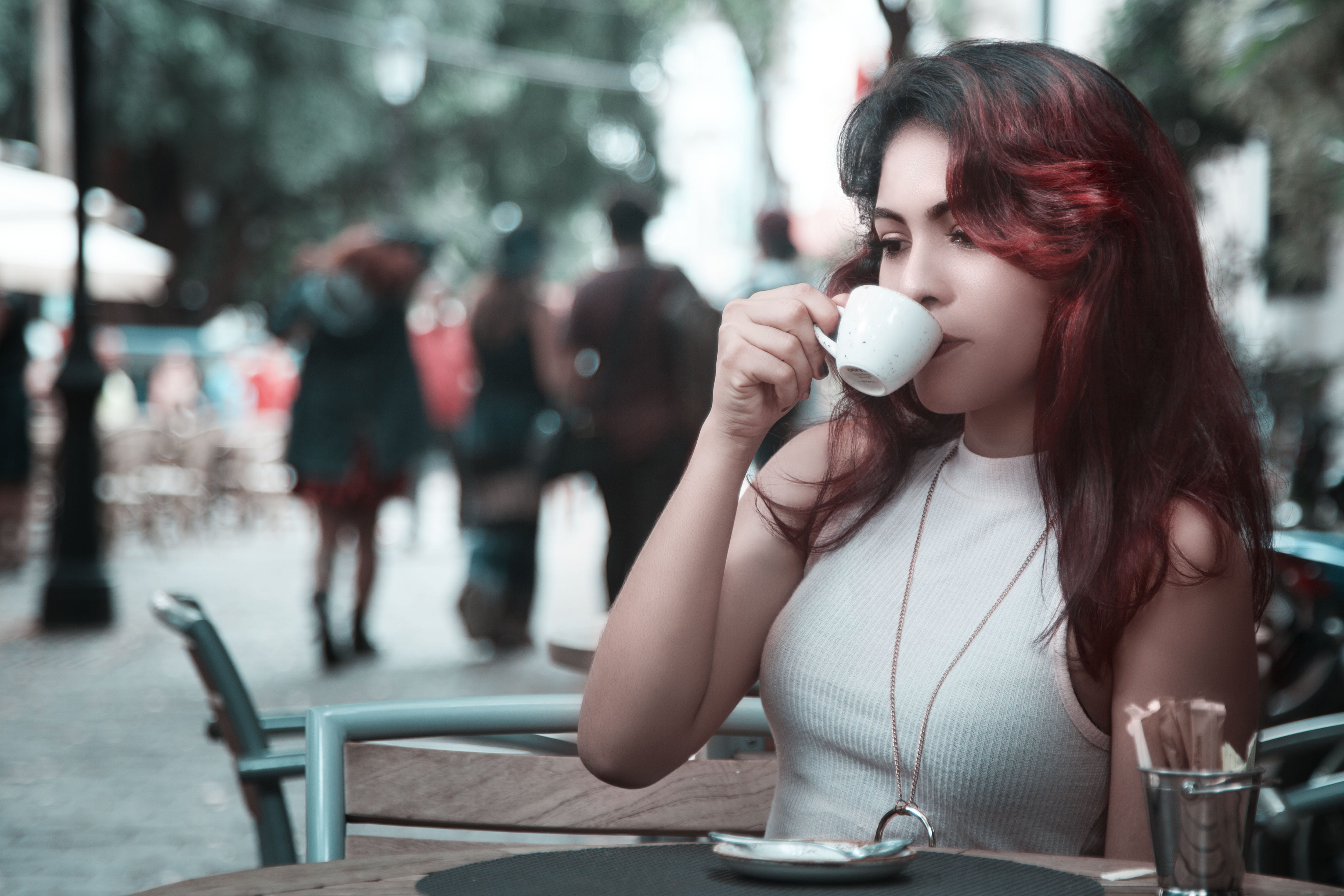 woman, coffee, coffee cup, city, girl sttig, girl, focus on foreground, white, necklace, drinking, holding, caucasian, drink, adult, ceramic, hairstyle, HD Wallpaper