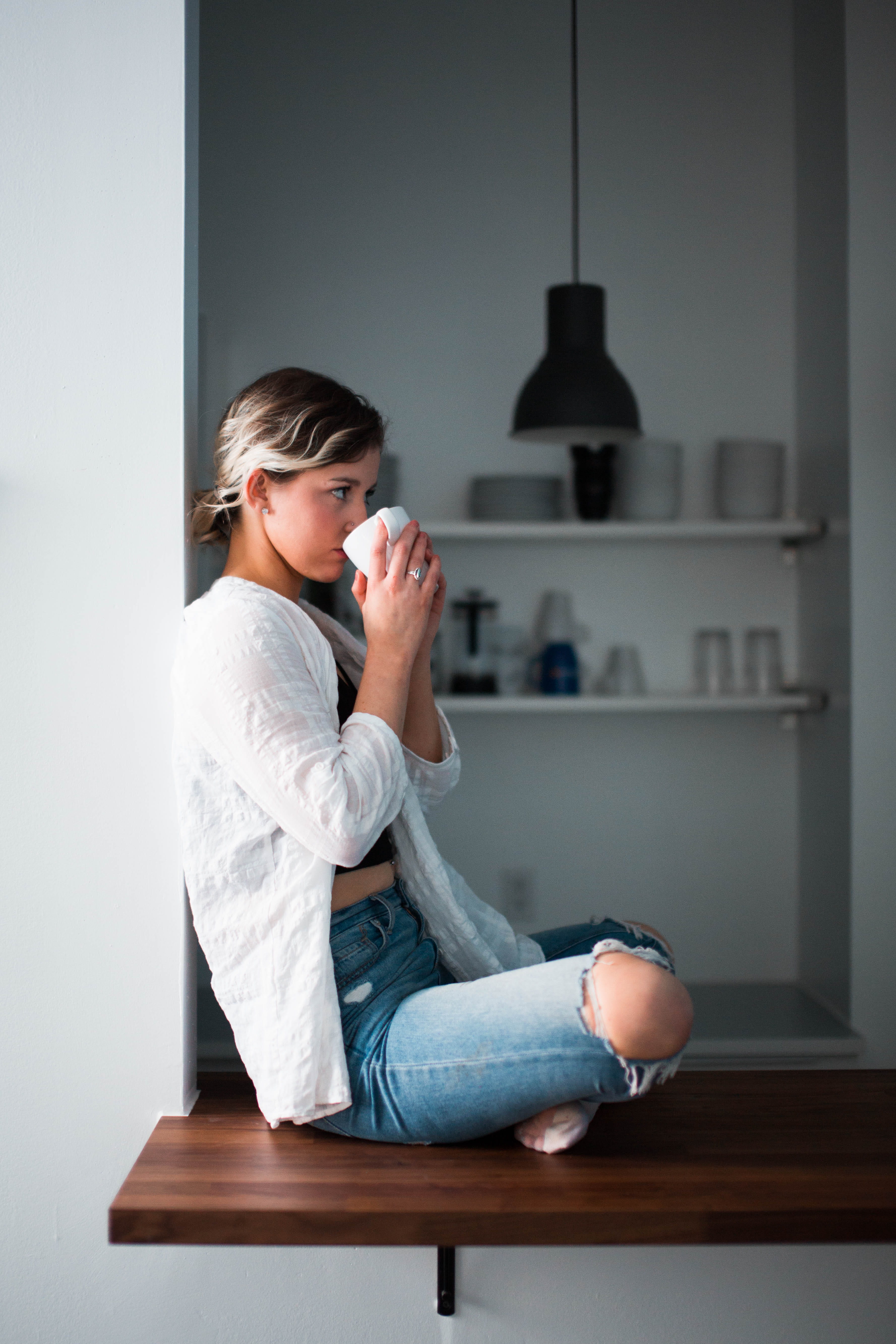 holding, casual clothing, hairstyle, one person, contemplation, three quarter length, adult, white, sitting, cup, window, 5K, relaxation, day, platform, Phone HD Wallpaper
