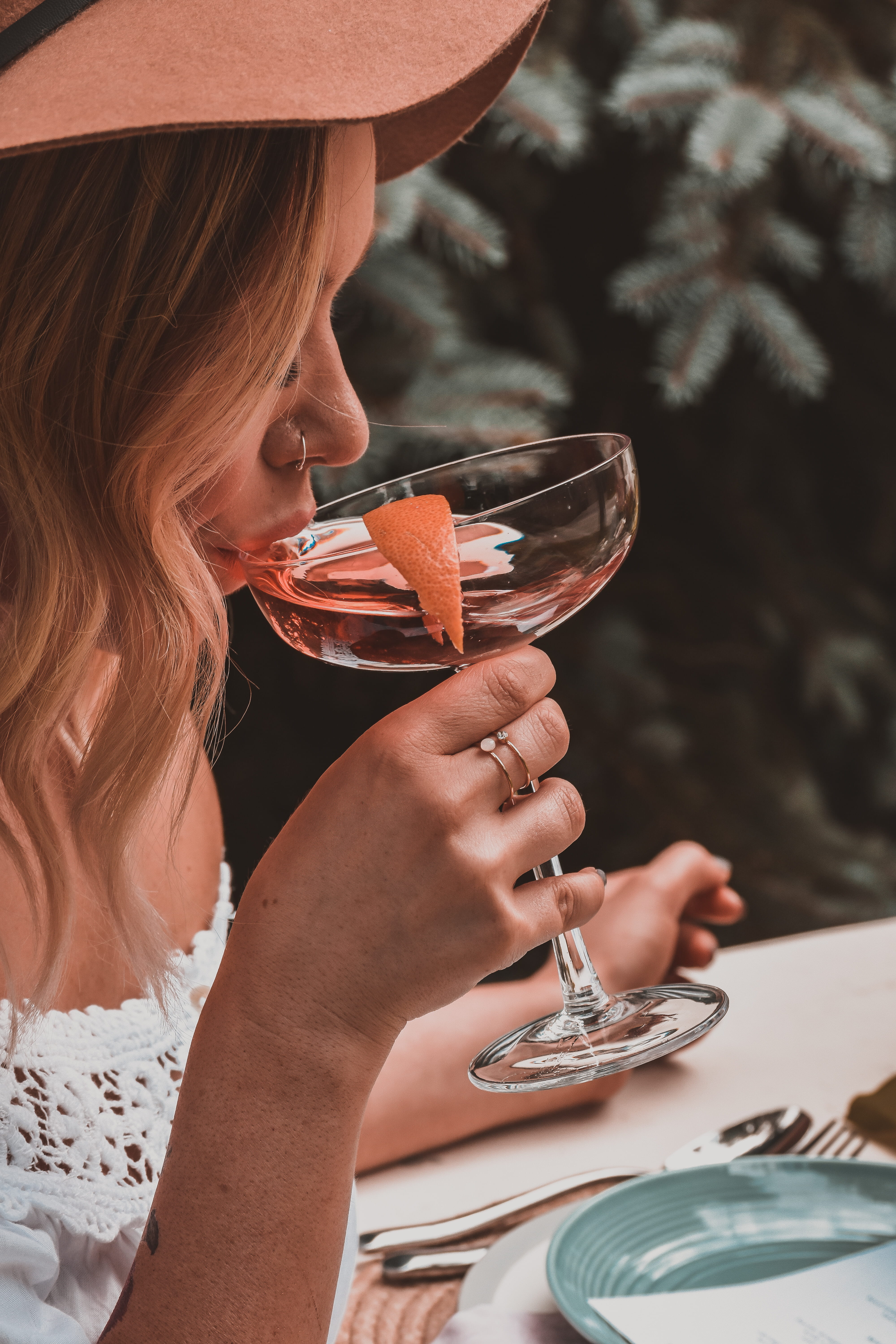 closeup, cheerful, holding, happiness, drinking Glass, restaurant, table, adult, women, fancy, summer, beauty, orange, glass, smiling, nose ring, table setting, Phone HD Wallpaper