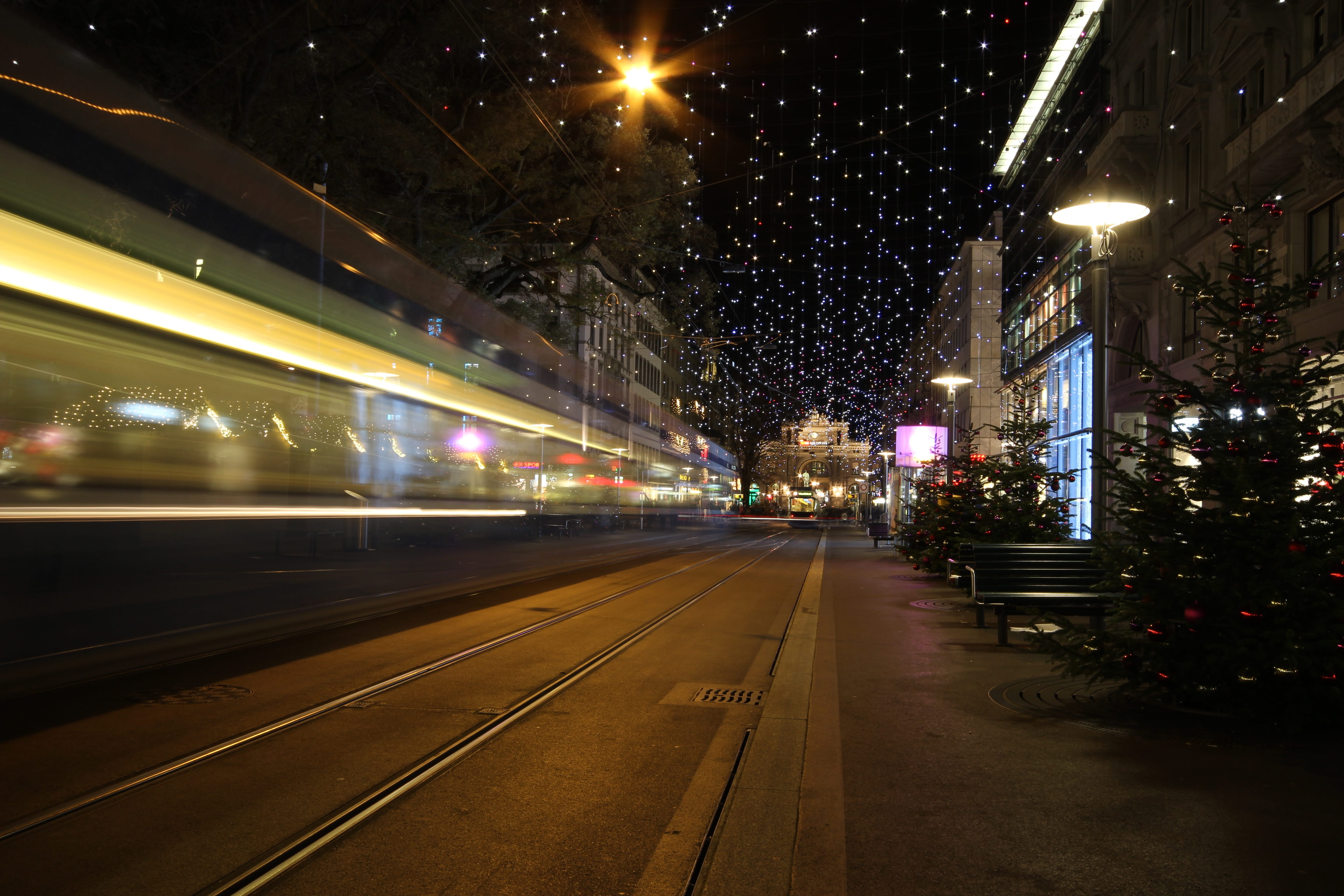 zurich main station, blurred motion, 5K, motion, no people, city, illuminated, Christmas, lamp, public transportation, speed, outdoors, Tram, building exterior, HD Wallpaper