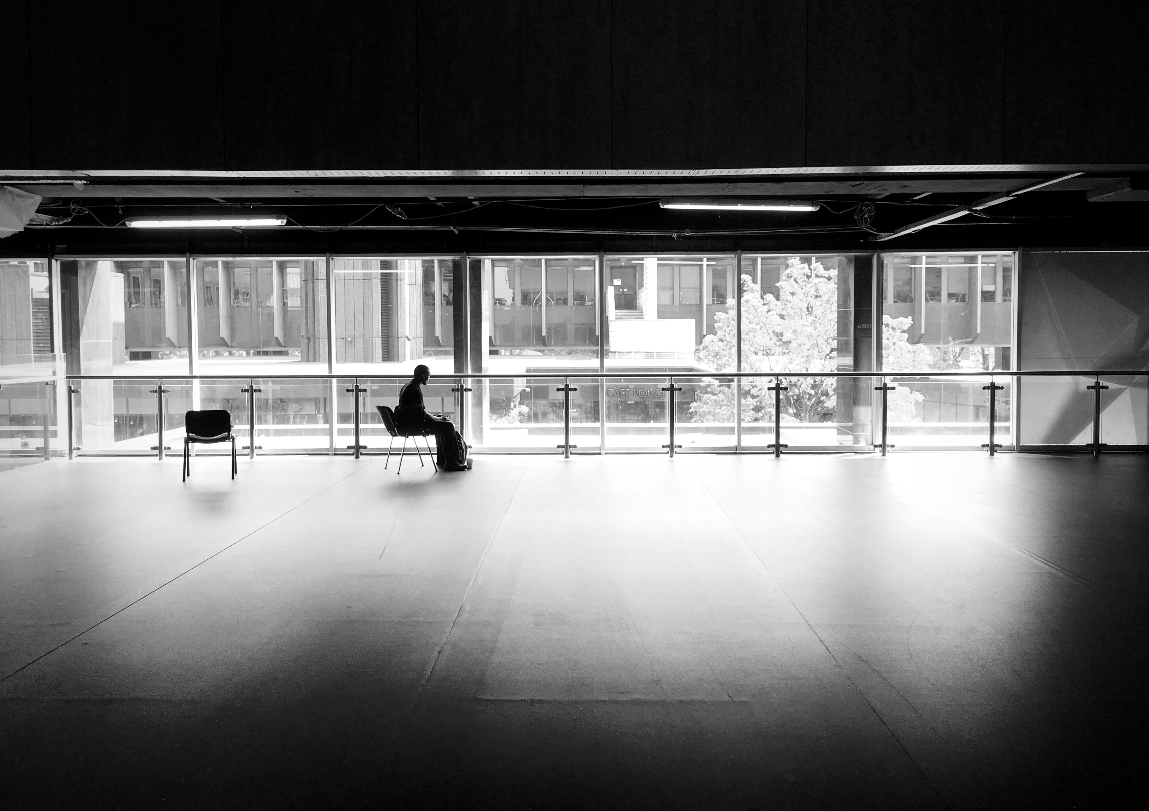 man, people, public transportation, illuminated, london, men, real people, transportation, architectural column, light, window, silhouette, flooring, sitting, HD Wallpaper