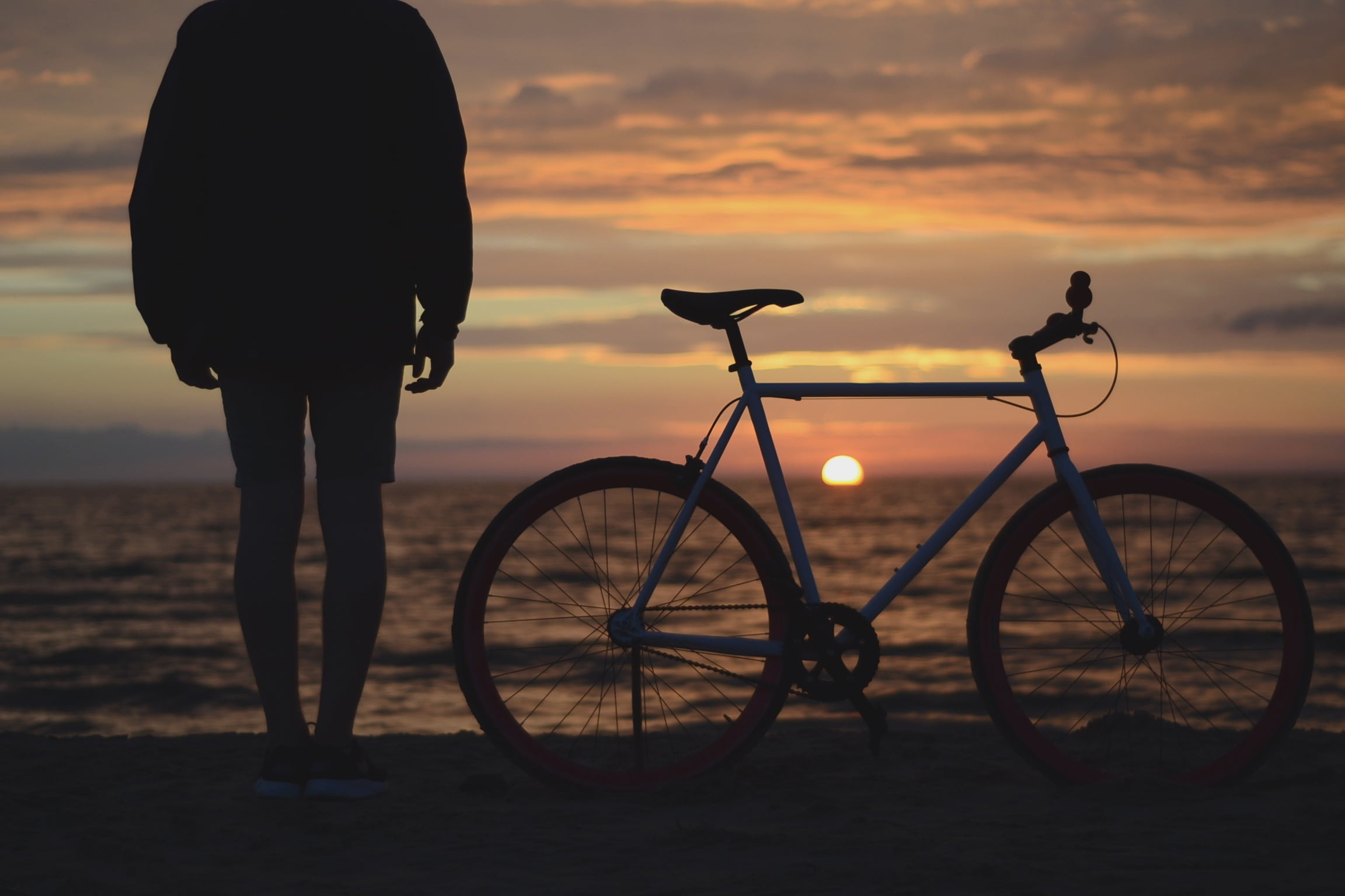 clouds, ride, orange color, stand, lifestyles, pedal, sunset, shore, beach, sun, beauty in nature, shadows, real people, bike, horizon, photo, land, people, HD Wallpaper