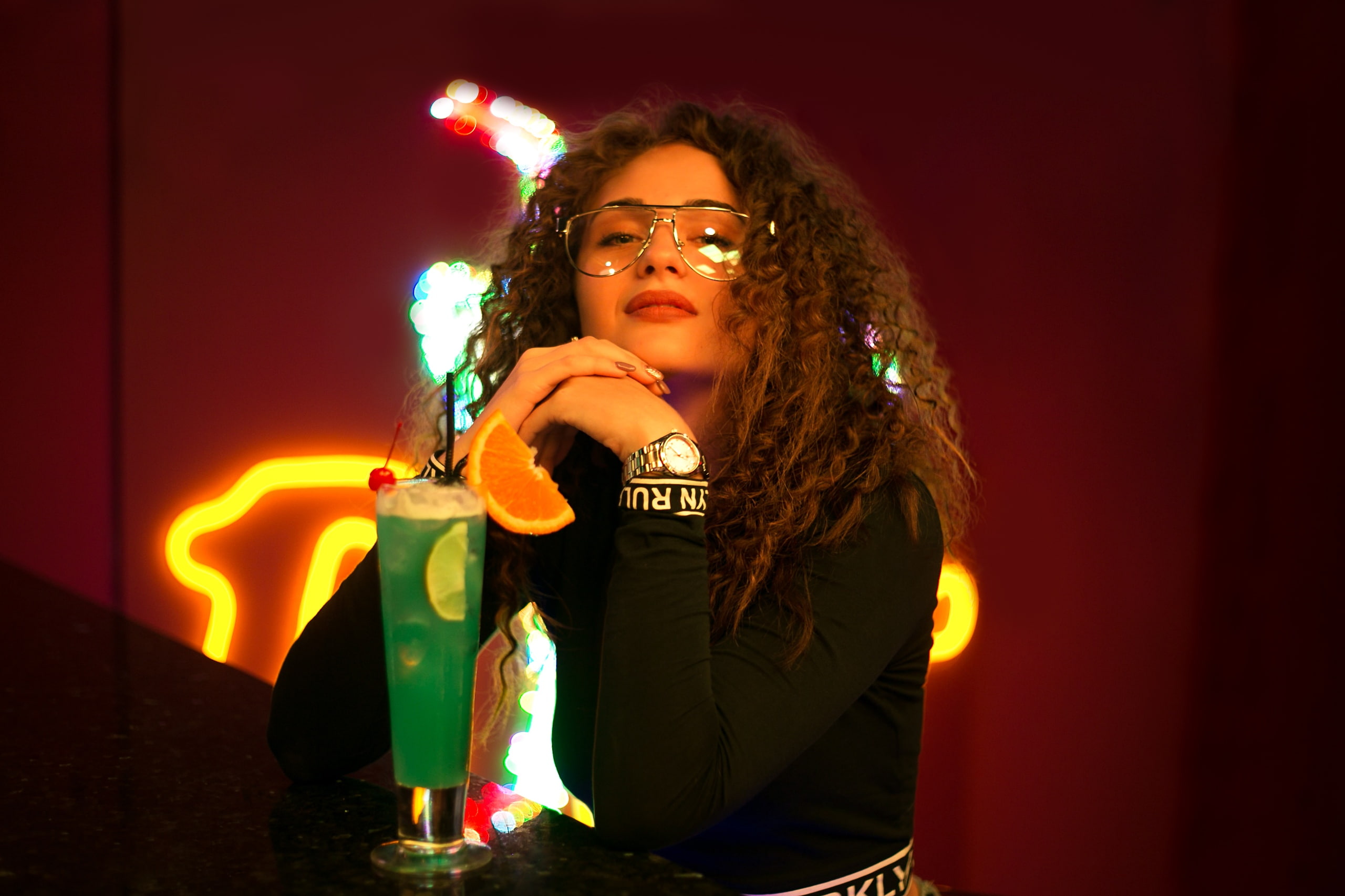 clothing, glowing, glasses, arts culture and entertainment, model, brunette, women indoors, bokeh, indoors, watch, young adult, lights, celebration, long hair, HD Wallpaper