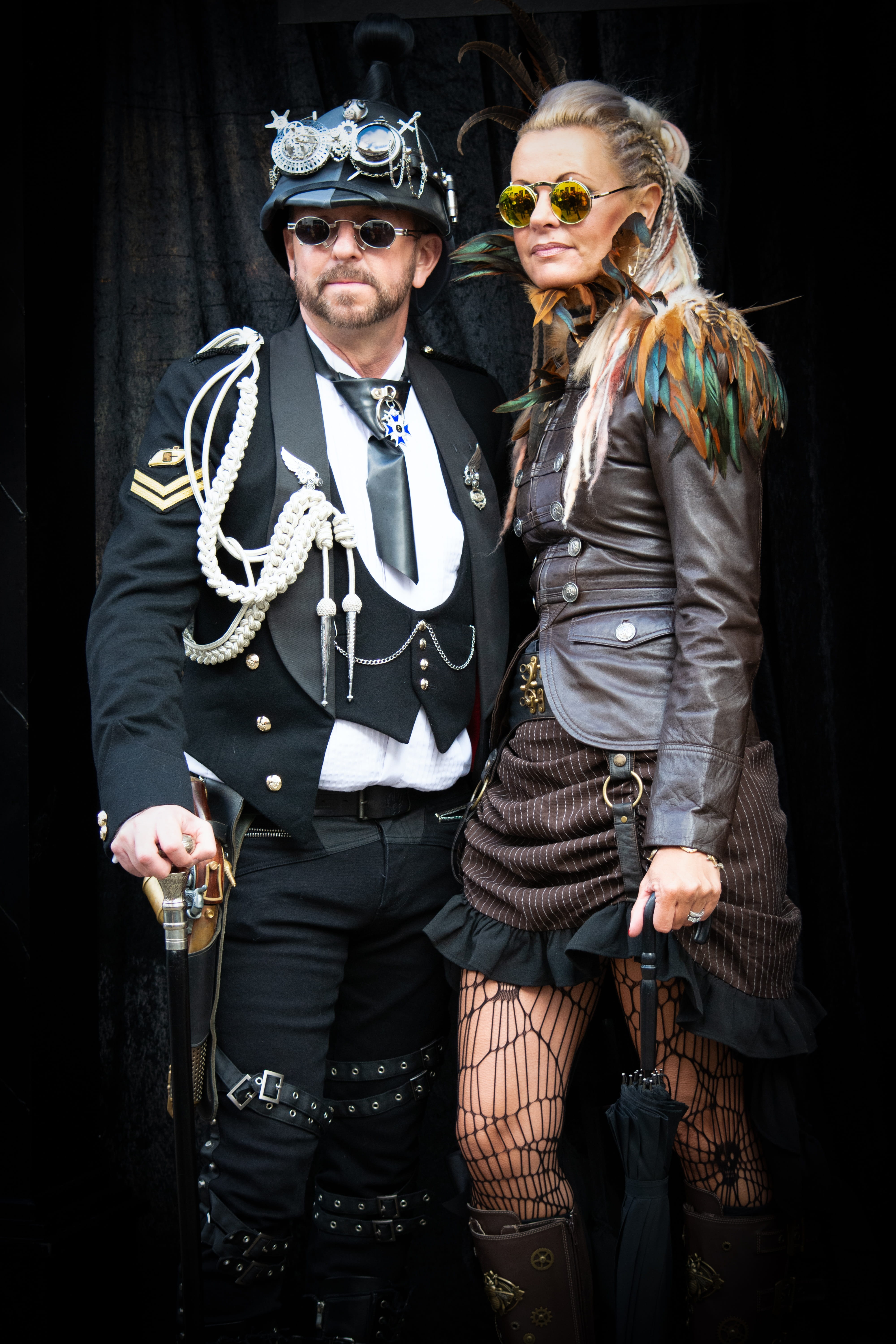 young women, indoors, headwear, looking at camera, couple, arm around, goggles, halloween, adult, leather coat, stick, three quarter length, hat, couple - relationship, Phone HD Wallpaper