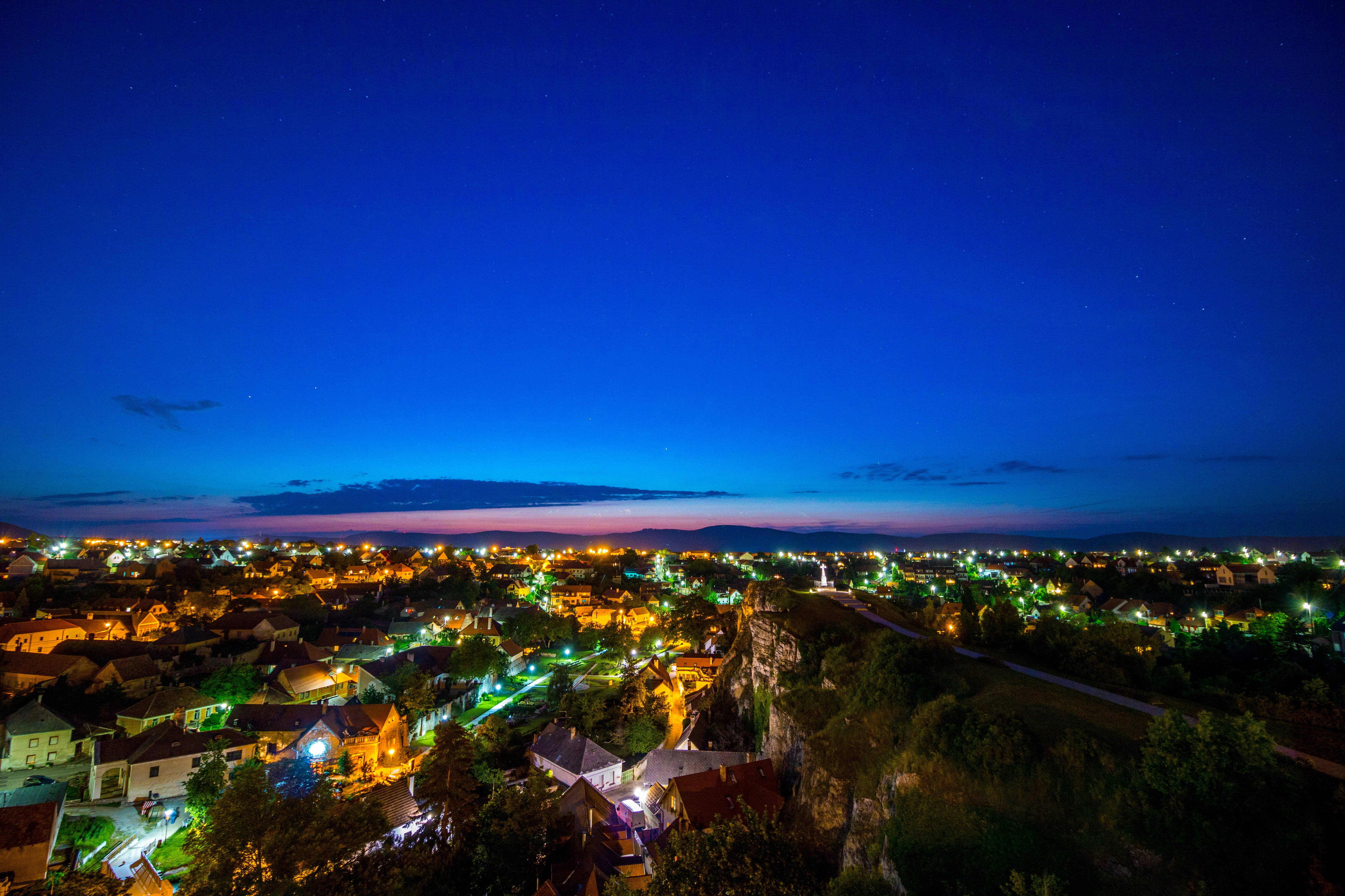 cloud - sky, silhouette, trees, blue, nighttime, aerial, 5K, architecture, horizon, suburbs, cityscape, photo, city, clouds, residential, lights, nature, HD Wallpaper