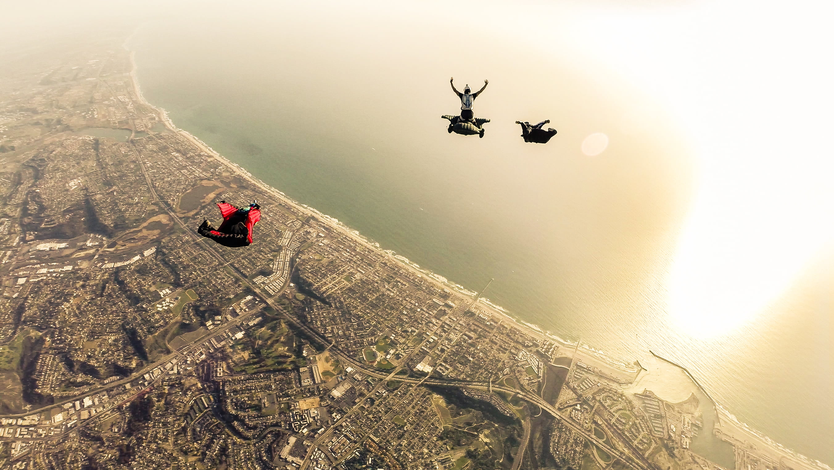 container, sea, air vehicle, extreme sports, transportation, outdoors, parachuting, group of people, parachute, real people, high angle view, wingsuit, HD Wallpaper