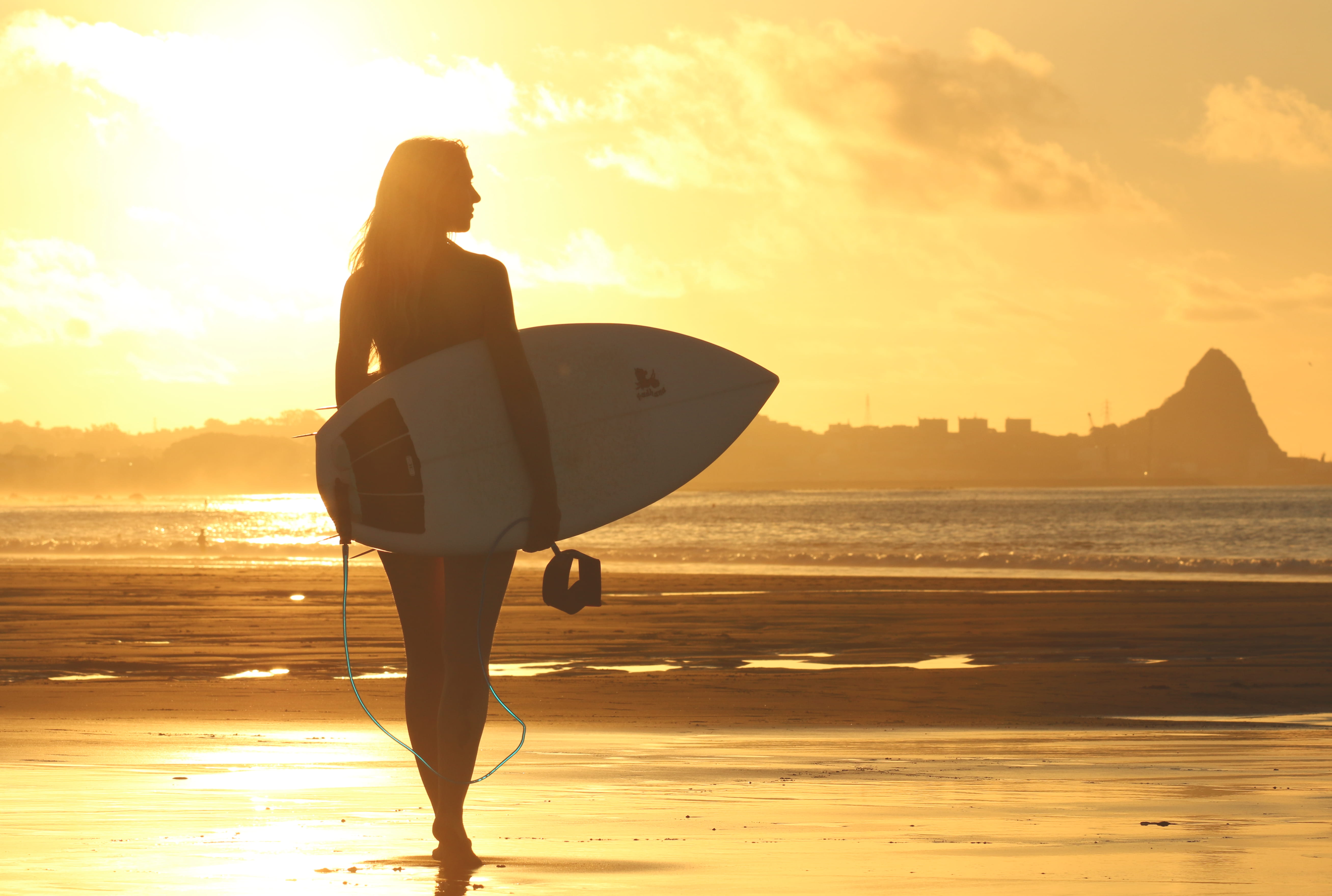 water, shoreline, dawn, land, surfer girl, recreation, seashore, summer, surfboard, sunset, adult, real people, orange color, full length, holding, beach, HD Wallpaper