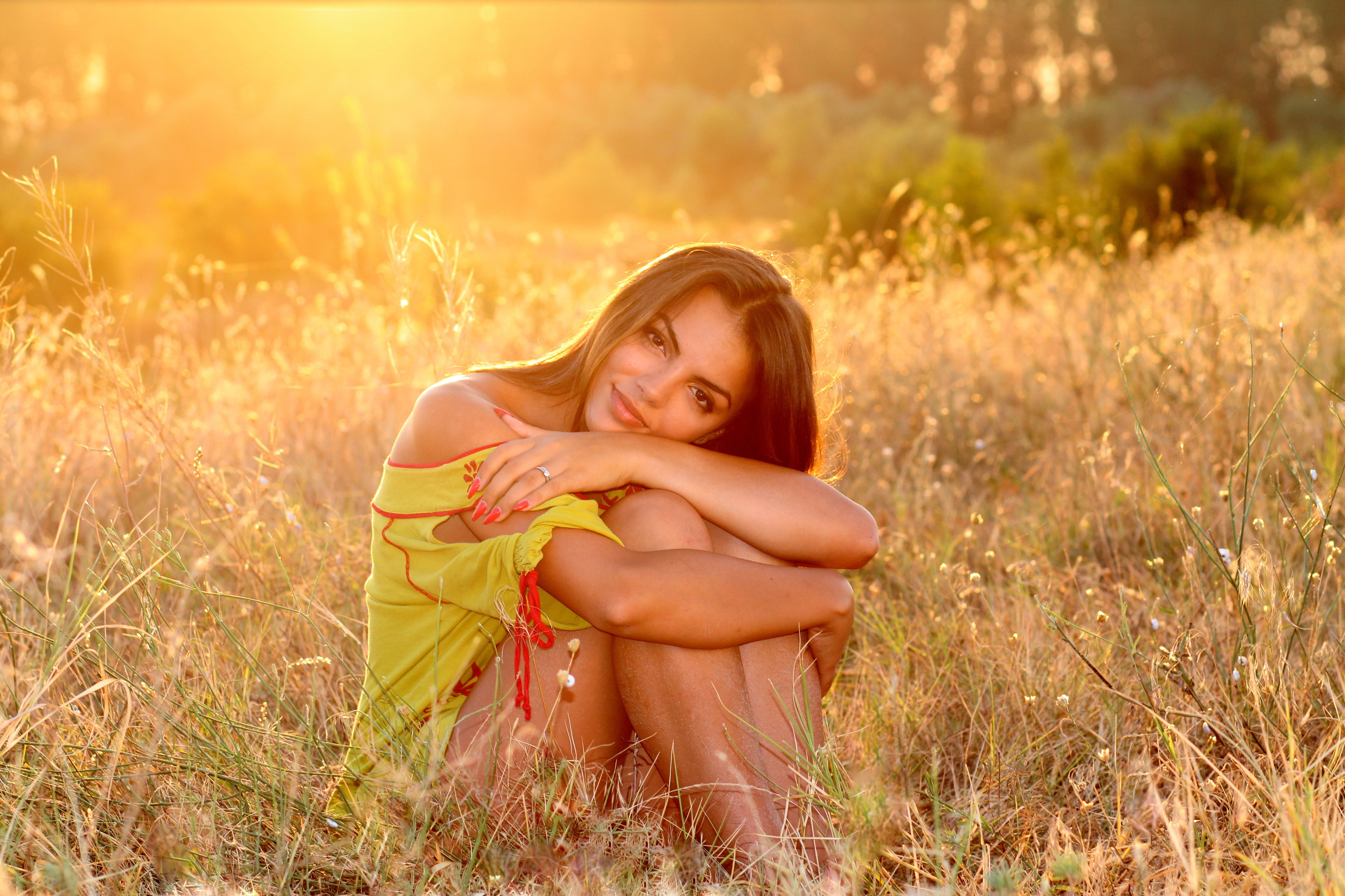 nature, beauty, women, in the evening, smiling, girl, hair, brown eyes, adolescence, plant, full length, sitting, yellow, sunset, adults only, emotion, HD Wallpaper