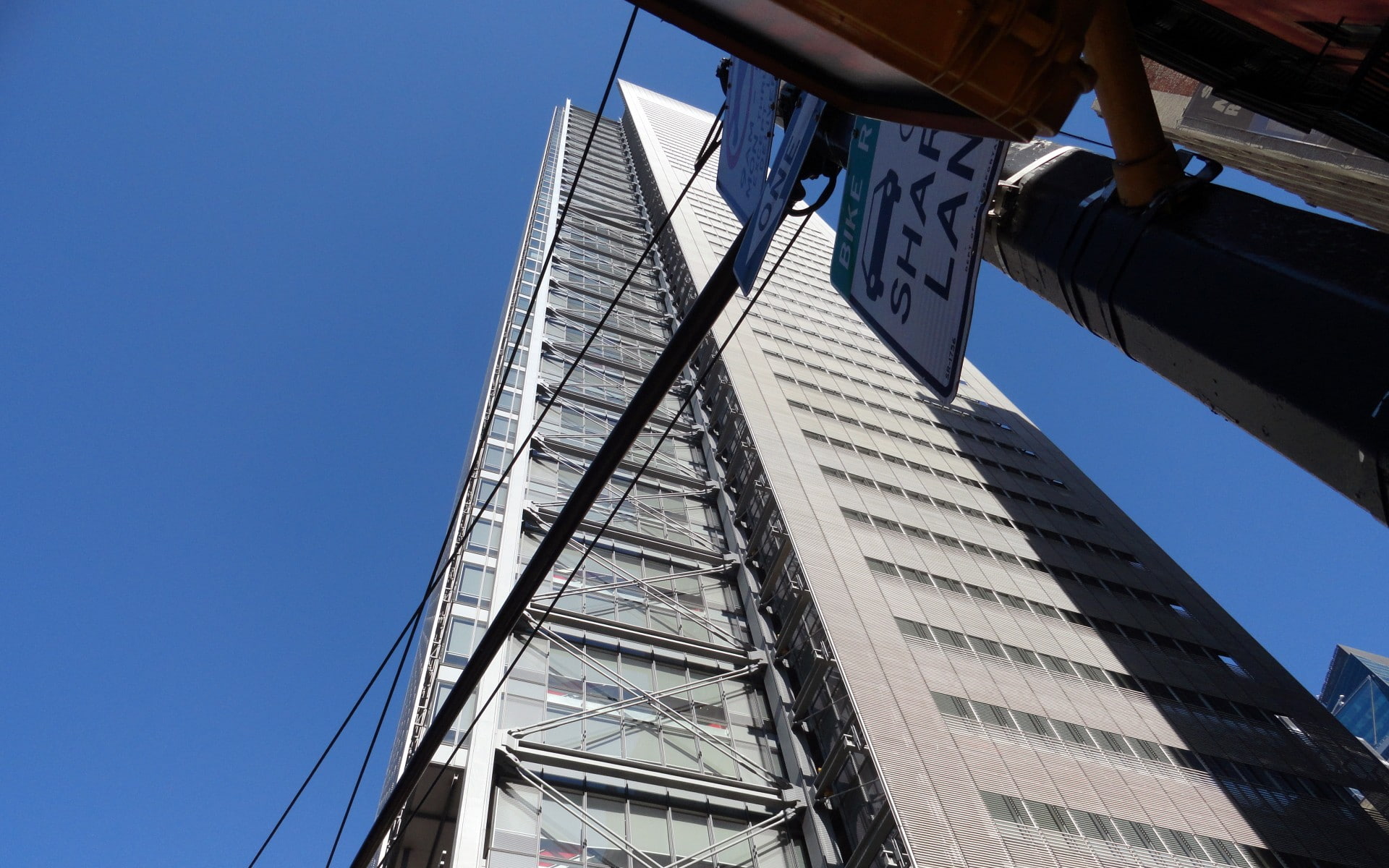office building exterior, power lines, city, road sign, day, sky, low angle view, no people, building exterior, 1080P, architecture, travel destinations, HD Wallpaper