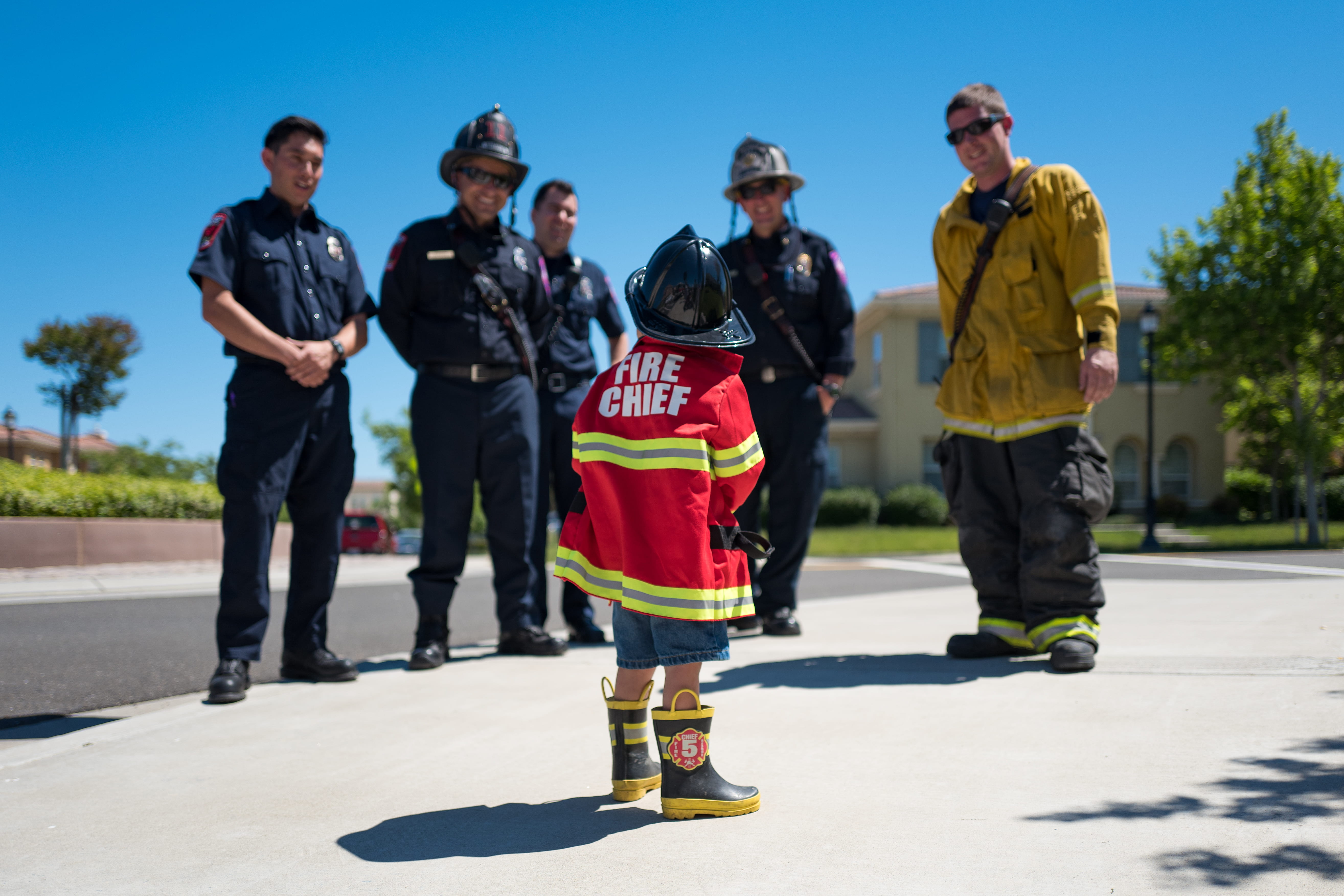 toddler, nature, adult, firemen, yellow, government, mid adult, people, five, boot, chief, residential, red, standing, child, full length, sunlight, 5K, HD Wallpaper