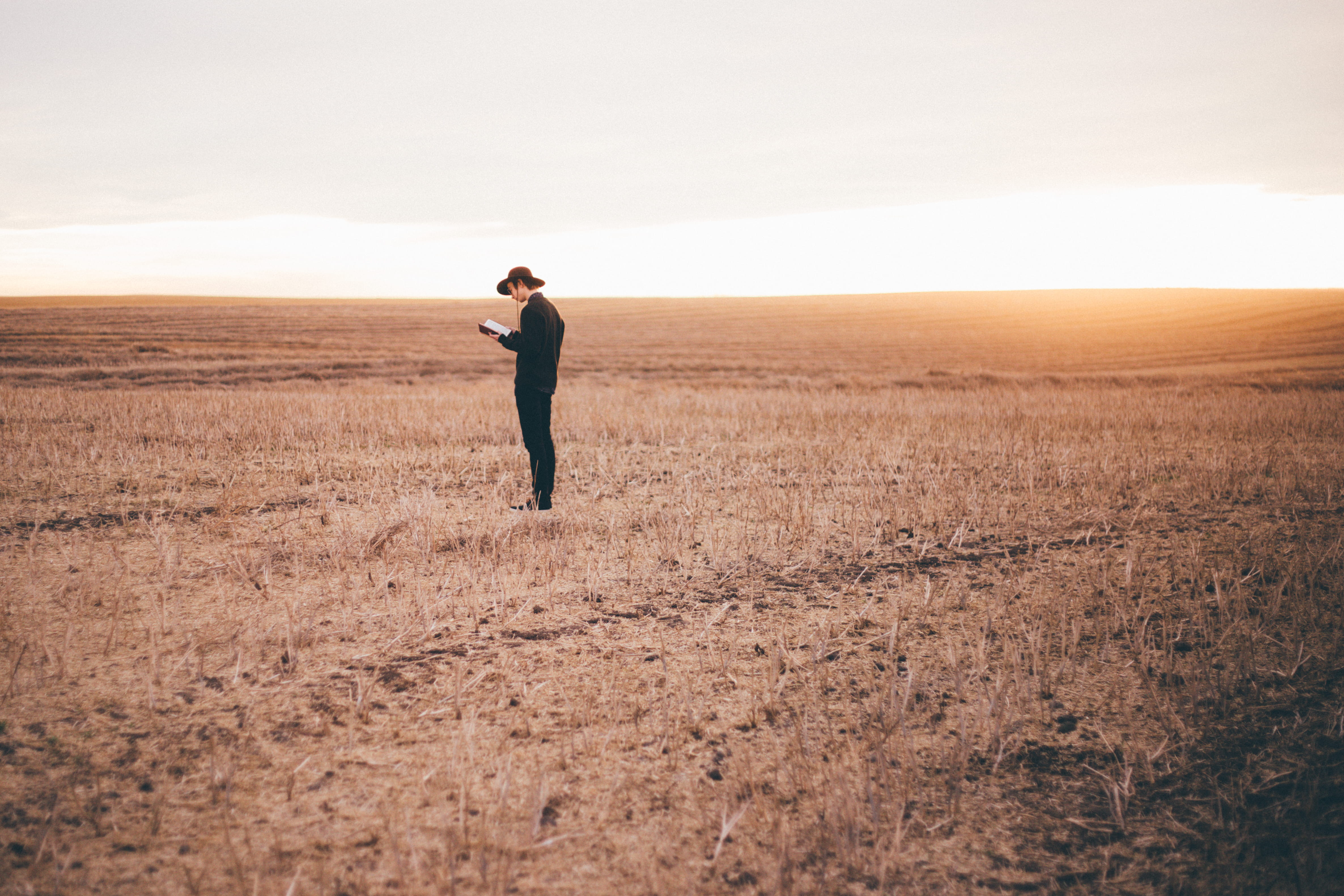healthy Lifestyle, sky, beauty in nature, reading book, rural, ground, standing, land, man in black, black, book, nature, person, exercising, copy Space, HD Wallpaper