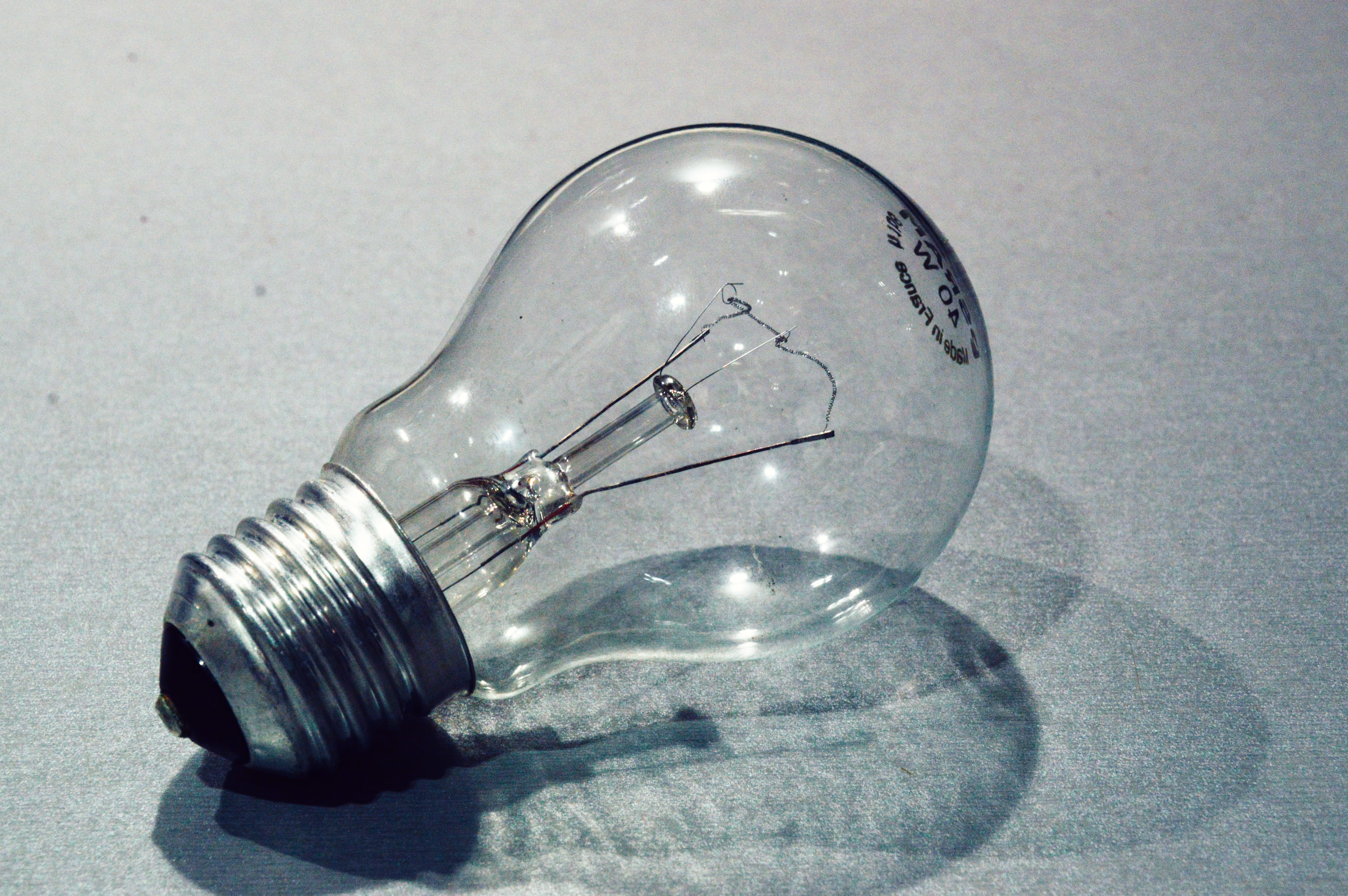 electricity, silver colored, light bulb, shiny, transparent, filament, no people, light, high angle view, still life, single object, indoors, glass - material, HD Wallpaper
