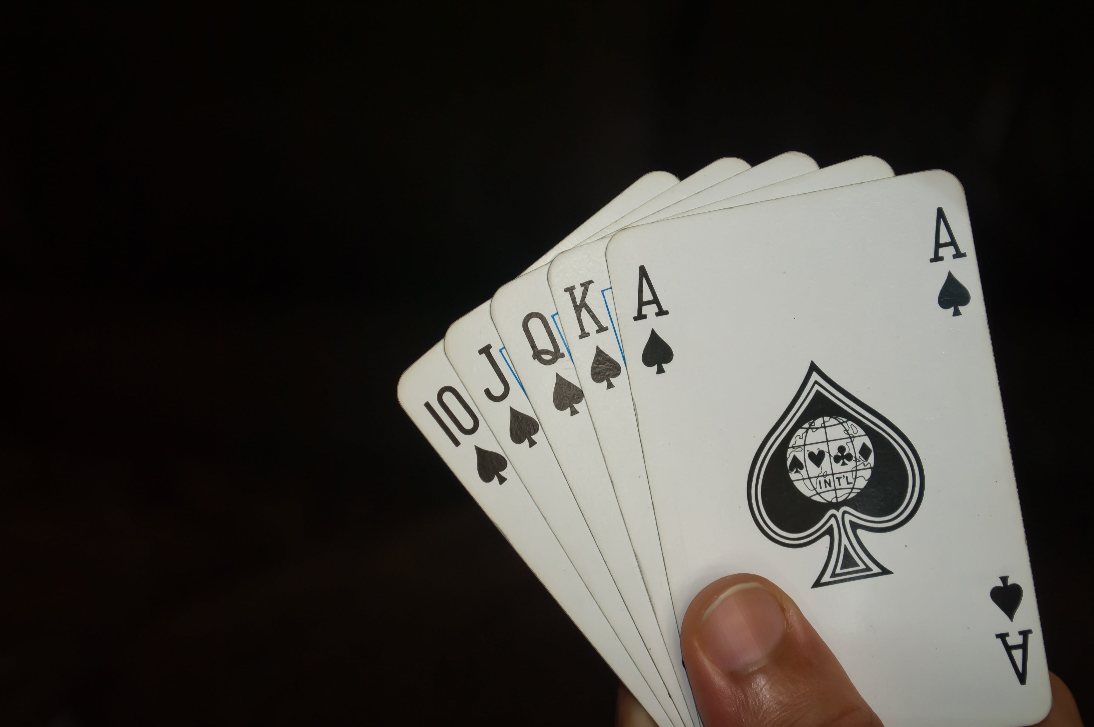 personal perspective, holding, black background, text, one person, poker - card game, gambling, poker, luck, person, cards, leisure activity, close-up, HD Wallpaper