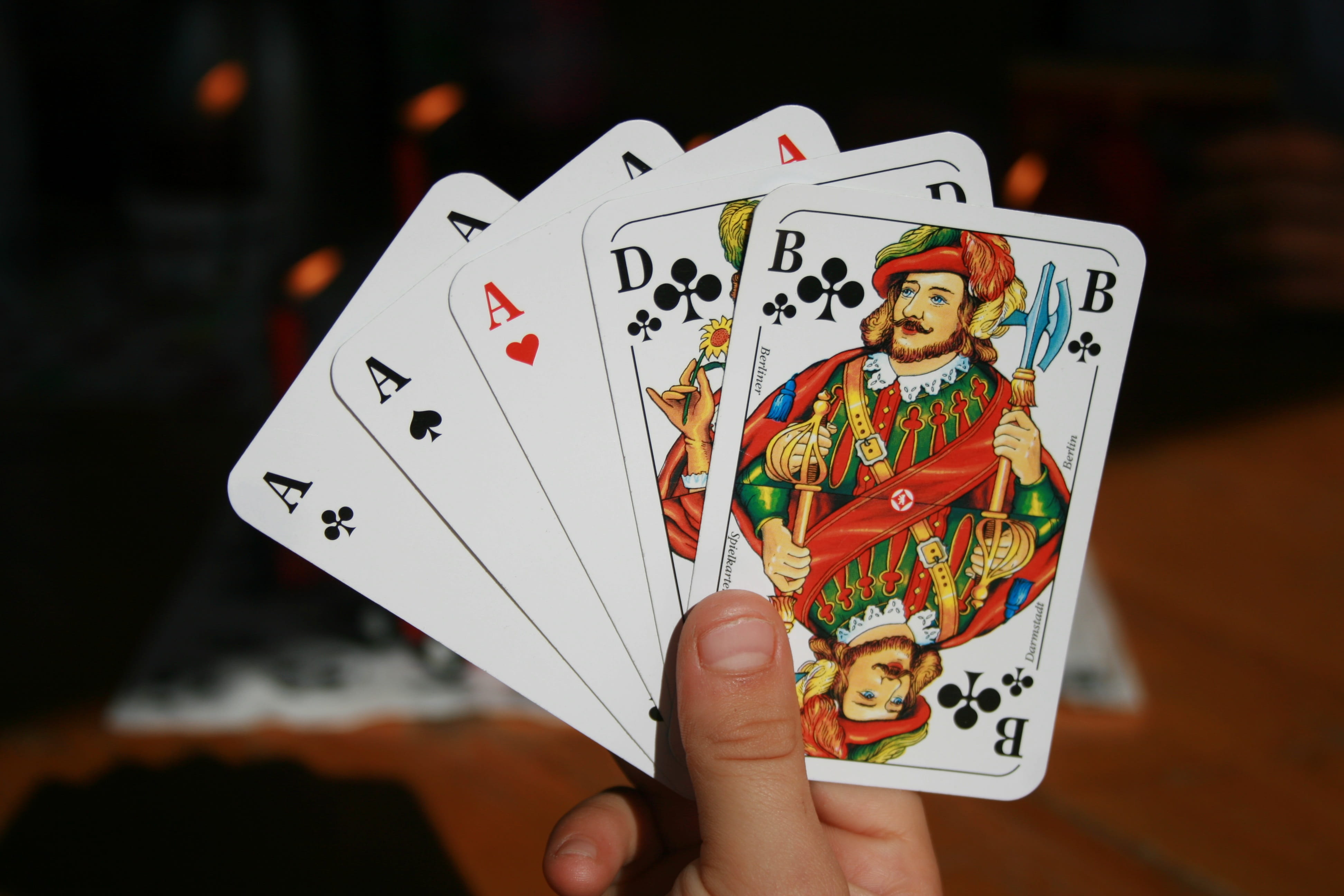 real people, playing Cards, holding, Card Game, one person, focus on foreground, human Hand, gambling, person, arts culture and entertainment, queen Card, HD Wallpaper