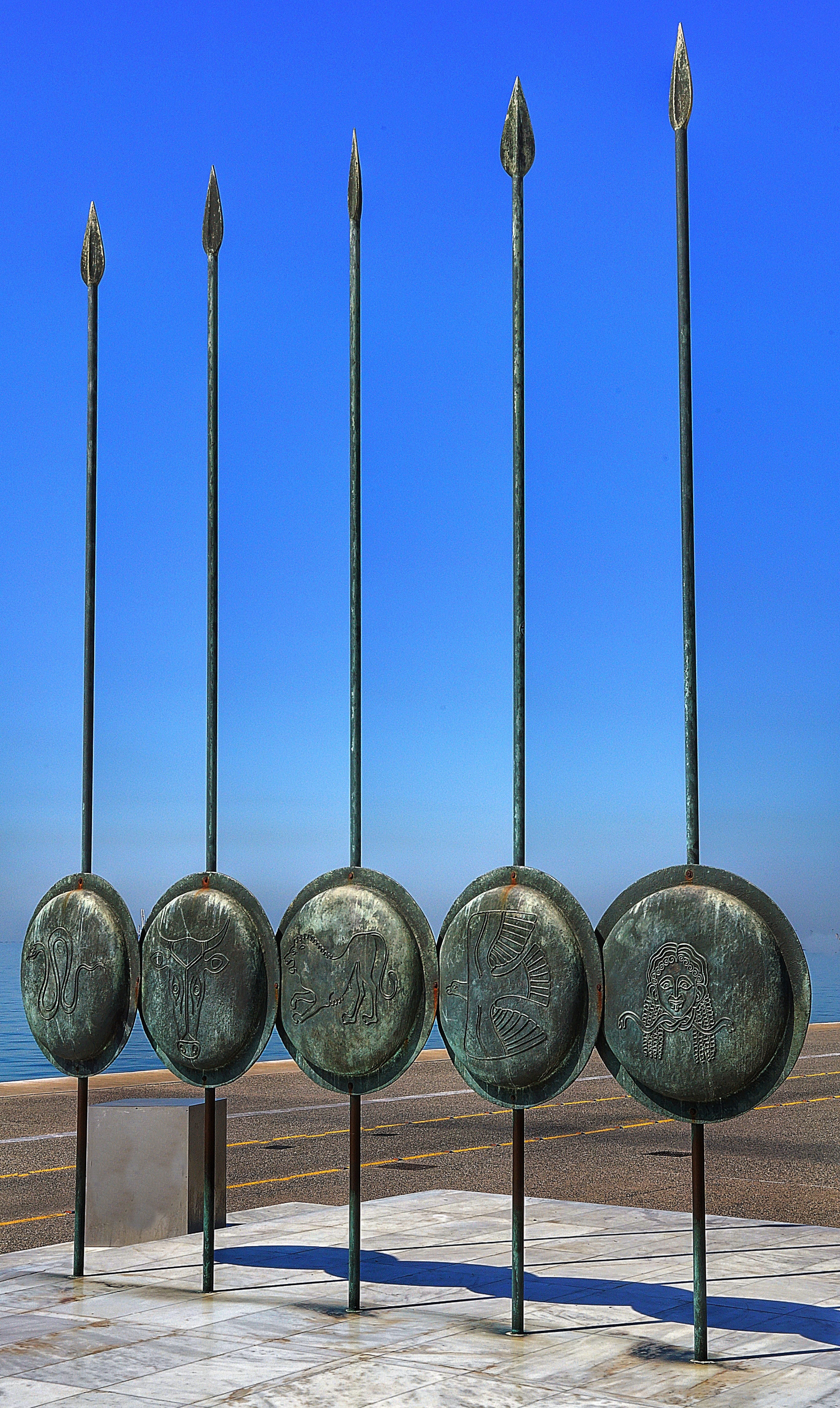 shields, sunlight, group of objects, side by side, outdoors, display, sky, metal, shadow, no people, nature, clear sky, architecture, spears, sculpture, Phone HD Wallpaper