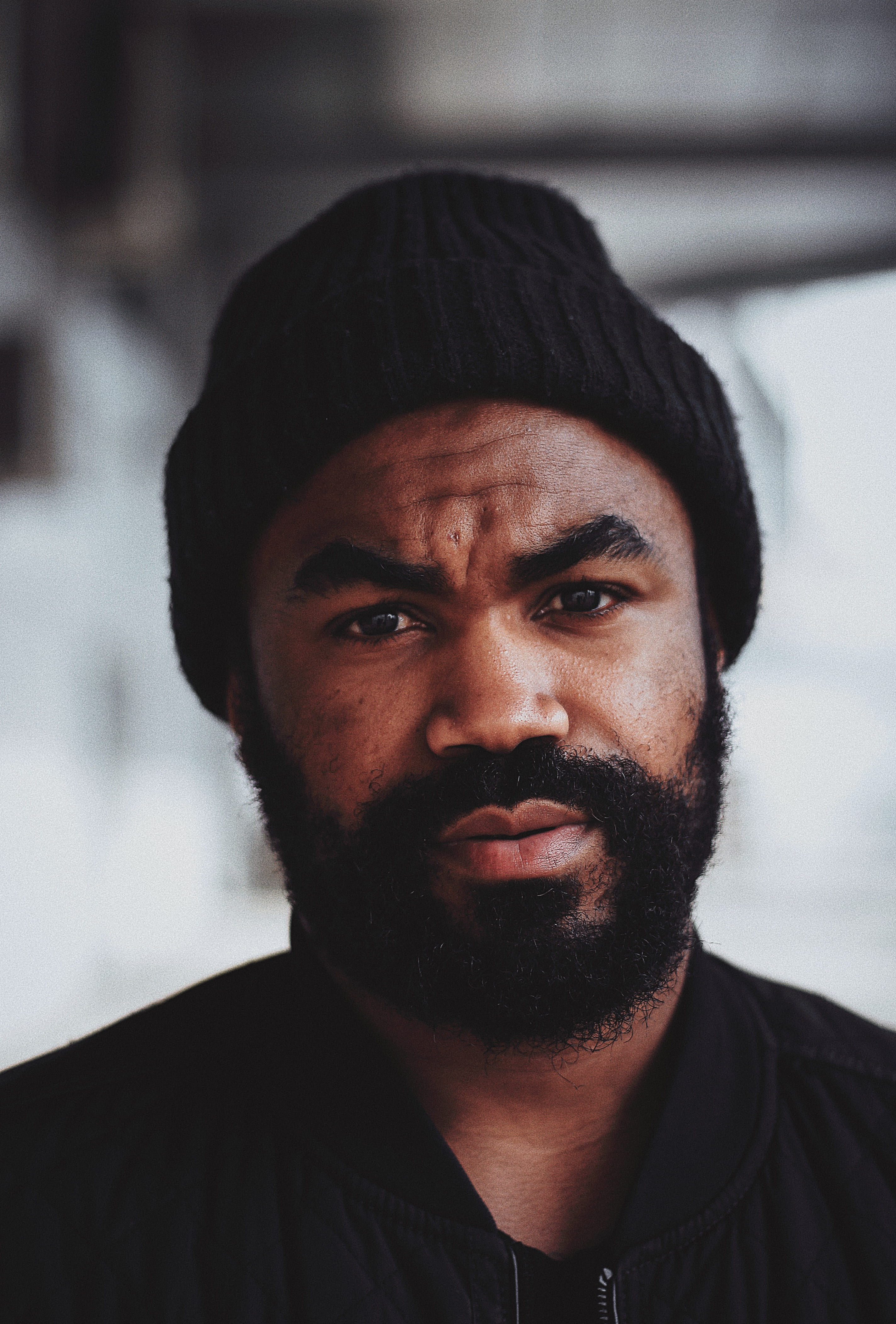 black, looking, emotion, males, face, body part, facial hair, headshot, portraitphotography, knit hat, sad, young adult, knit, men, contemplation, selective, Phone HD Wallpaper