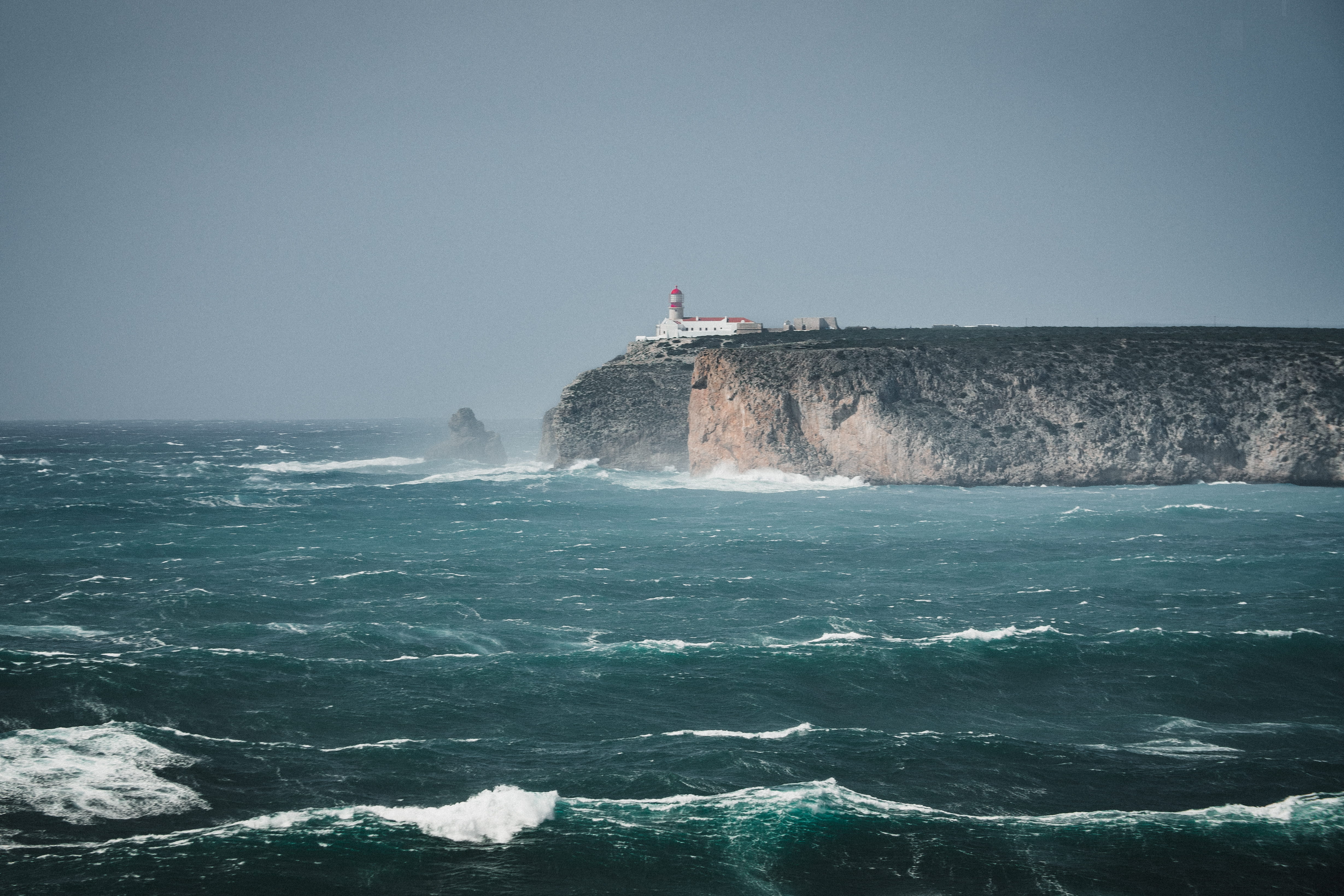 portugal, motion, outdoors, waves, building exterior, guidance, wind, rock - object, no people, nature, rocks, sea, power in nature, land, sagres, lighthouse, HD Wallpaper
