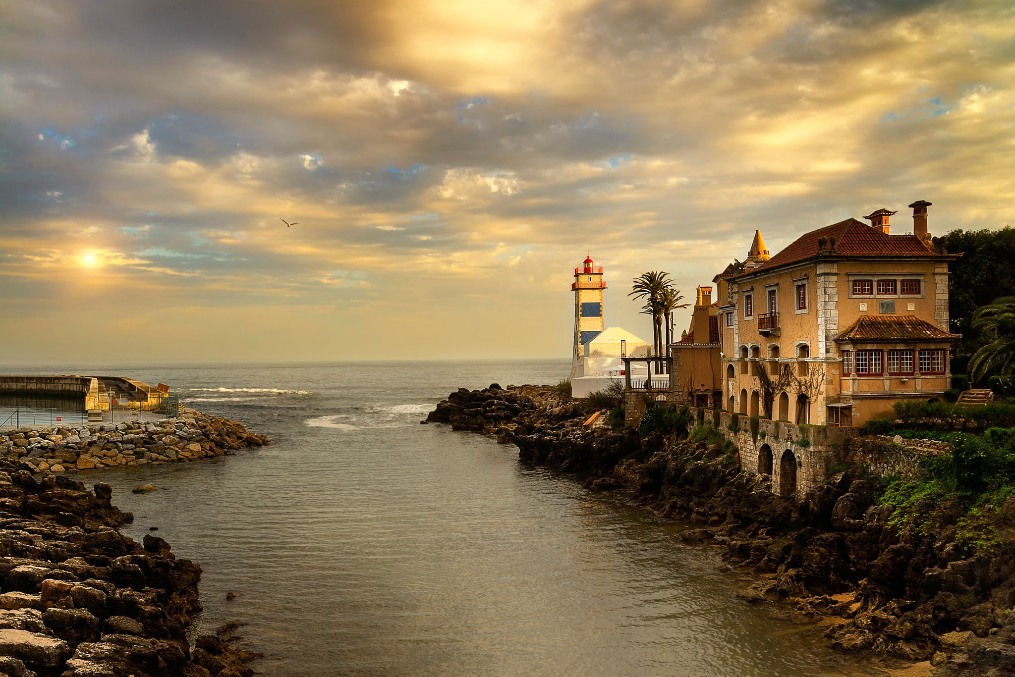 river, Sun, sea, water, palm trees, rock, old building, architecture, 1080P, clouds, birds, lighthouse, Portugal, stones, HD Wallpaper