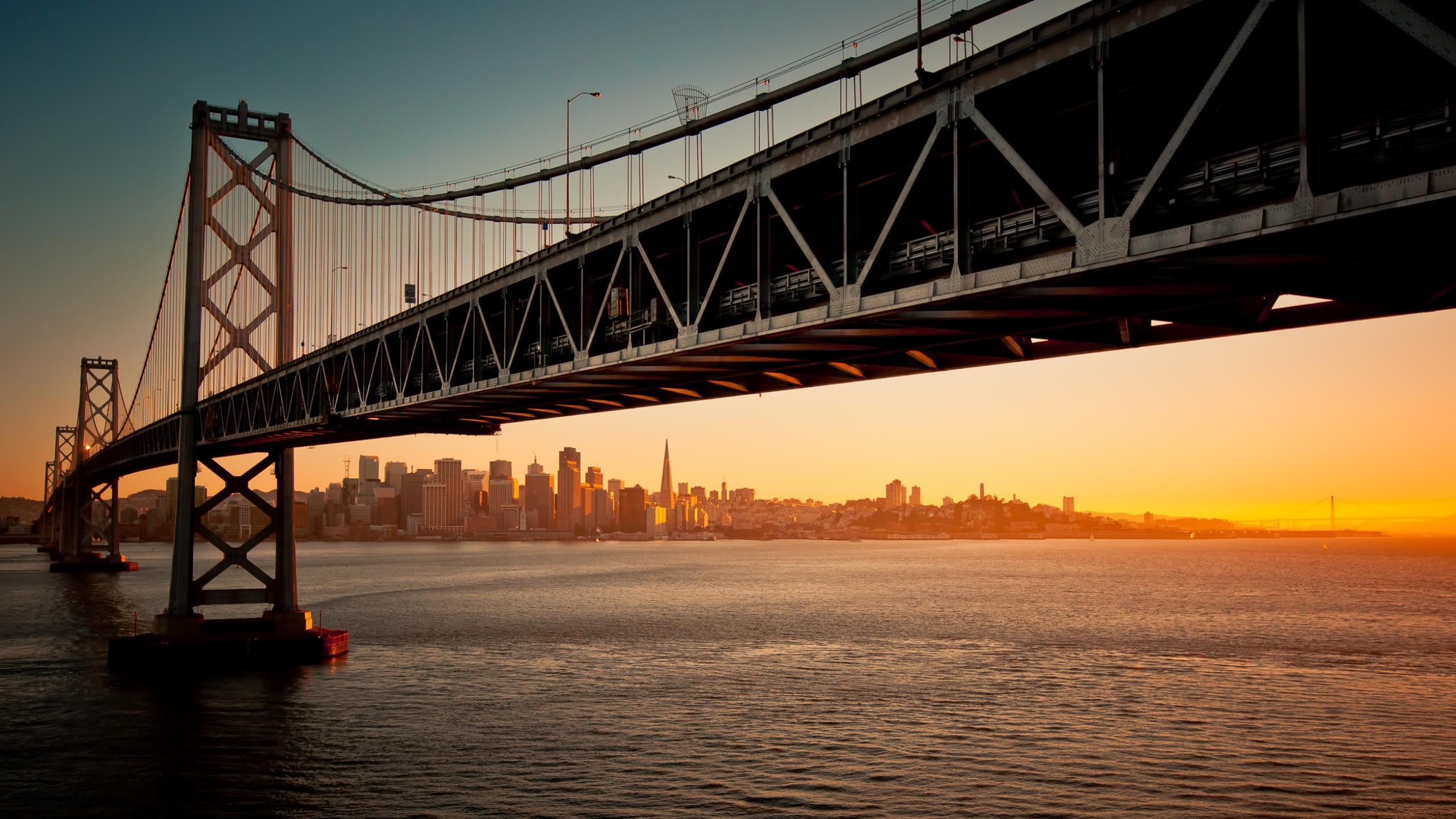 architecture, connection, sunset, cityscape, city, suspension, low, built structure, angle, 2K, outdoors, suspension bridge, skyscraper, transportation, HD Wallpaper