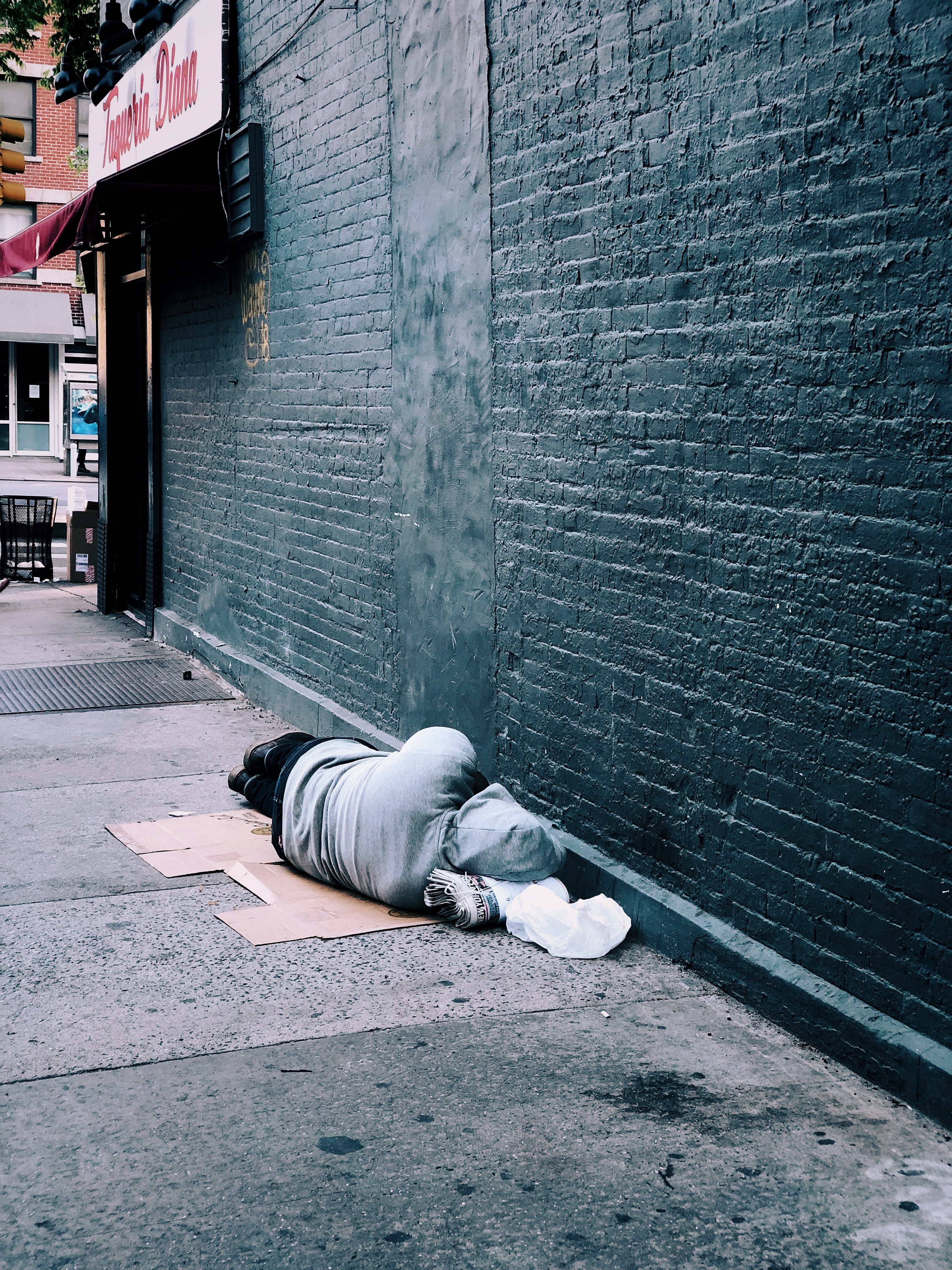 sleeping, cardboard, box, wall - building feature, pain, person, brick, lying down, asleep, lost, outdoors, building, footpath, building exterior, vertebrate, Phone HD Wallpaper