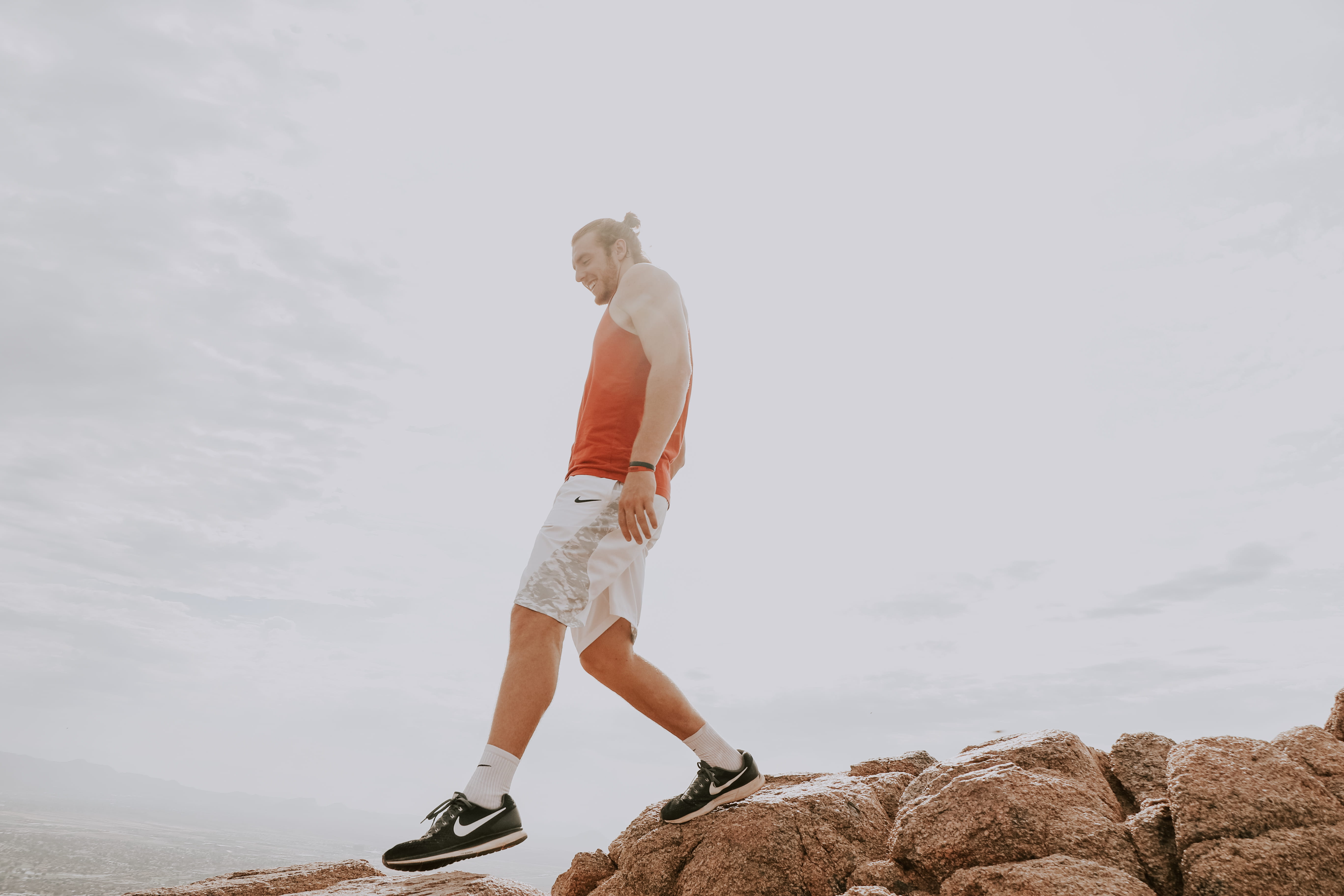 full length, man, rocks, young adult, wearing, shoe, sky, copy space, 5K, apparel, orange, top, united states, brown, shorts, cloud - sky, young men, camelback mountain, HD Wallpaper