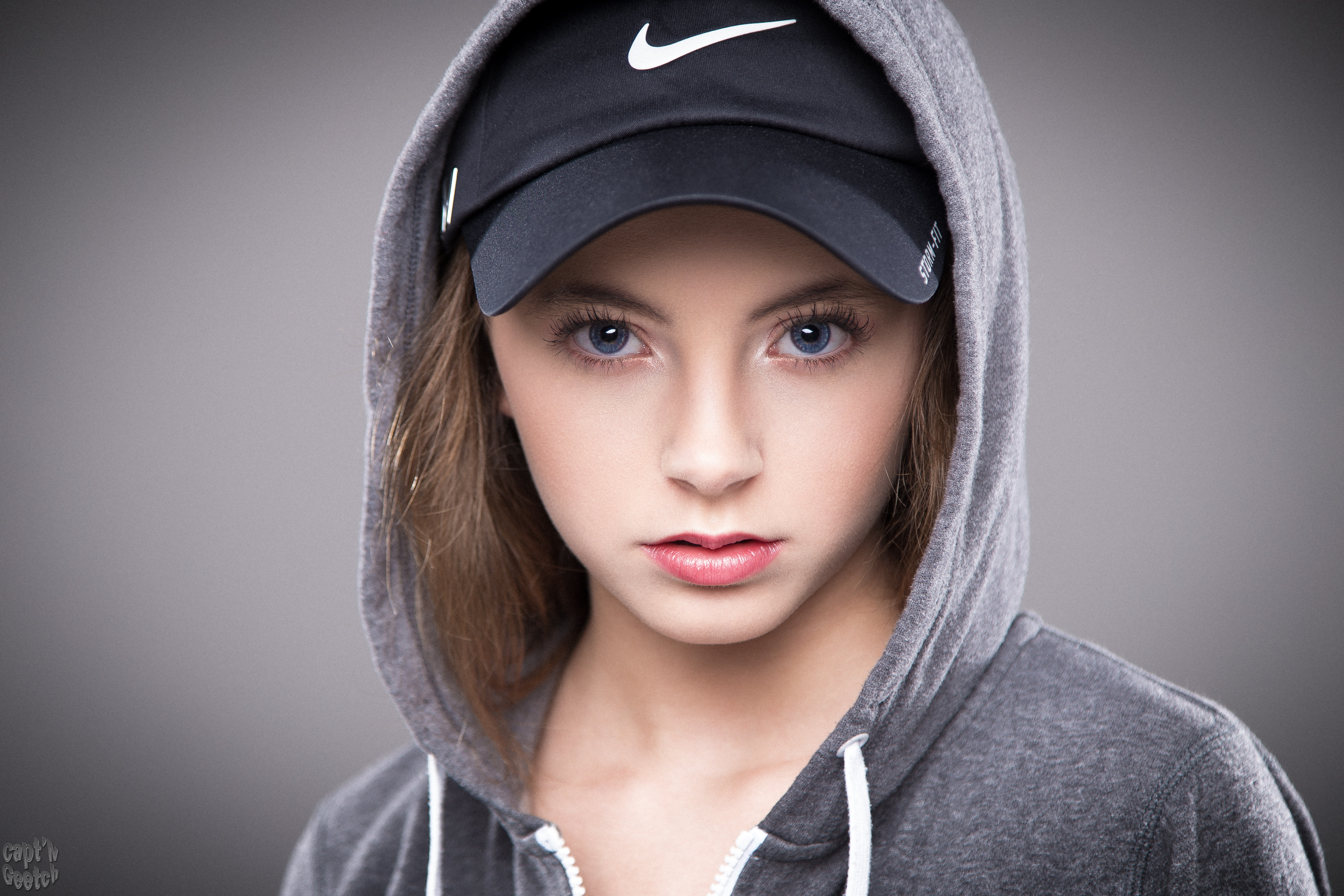 5K, simple background, portrait, blonde, looking at viewer, face, blue eyes, baseball caps, hoods, HD Wallpaper