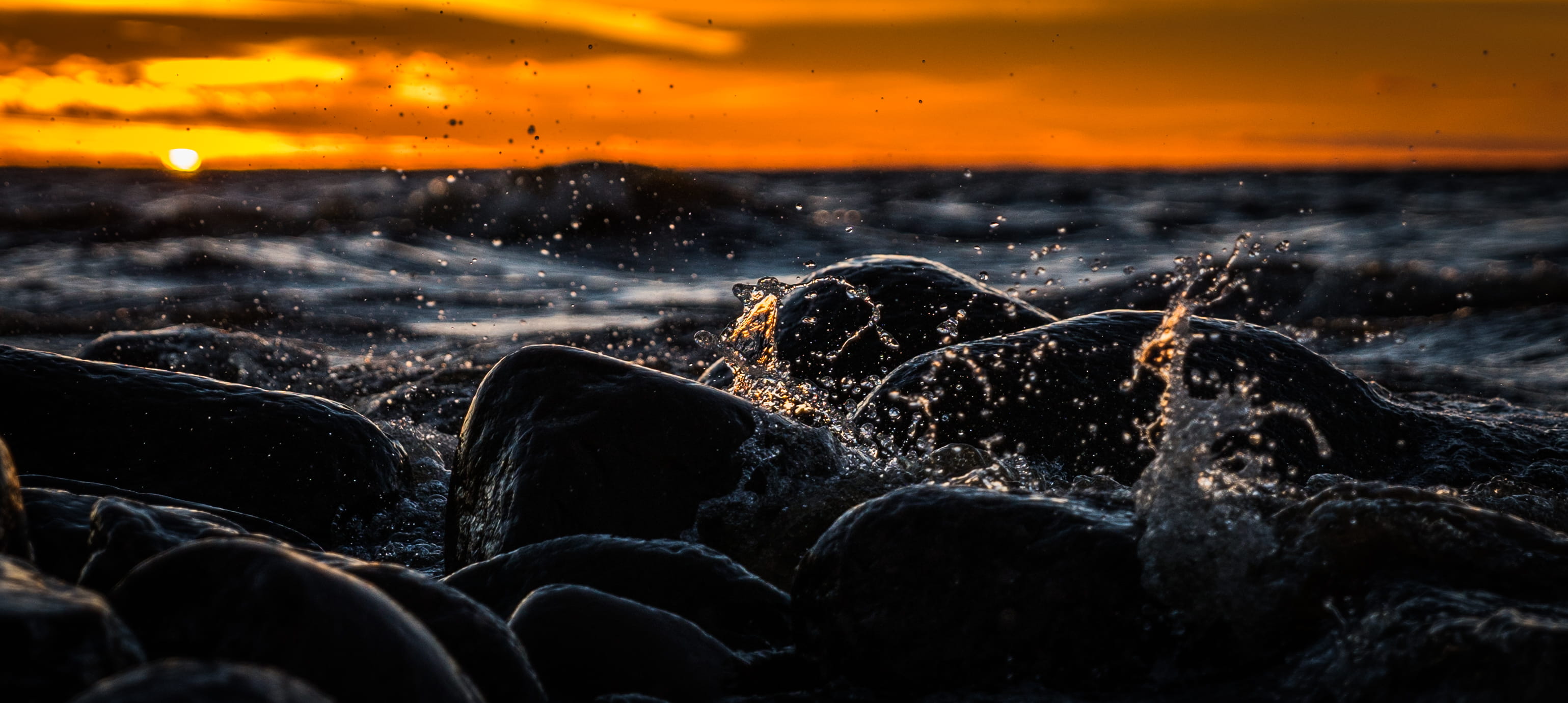 beach, outdoors, dawn, sunset, rock, sun, body, solid, splash, sea, rocks, close-up, sky, wate, cloud - sky, power in nature, evening, travel, ocean, landscape, HD Wallpaper