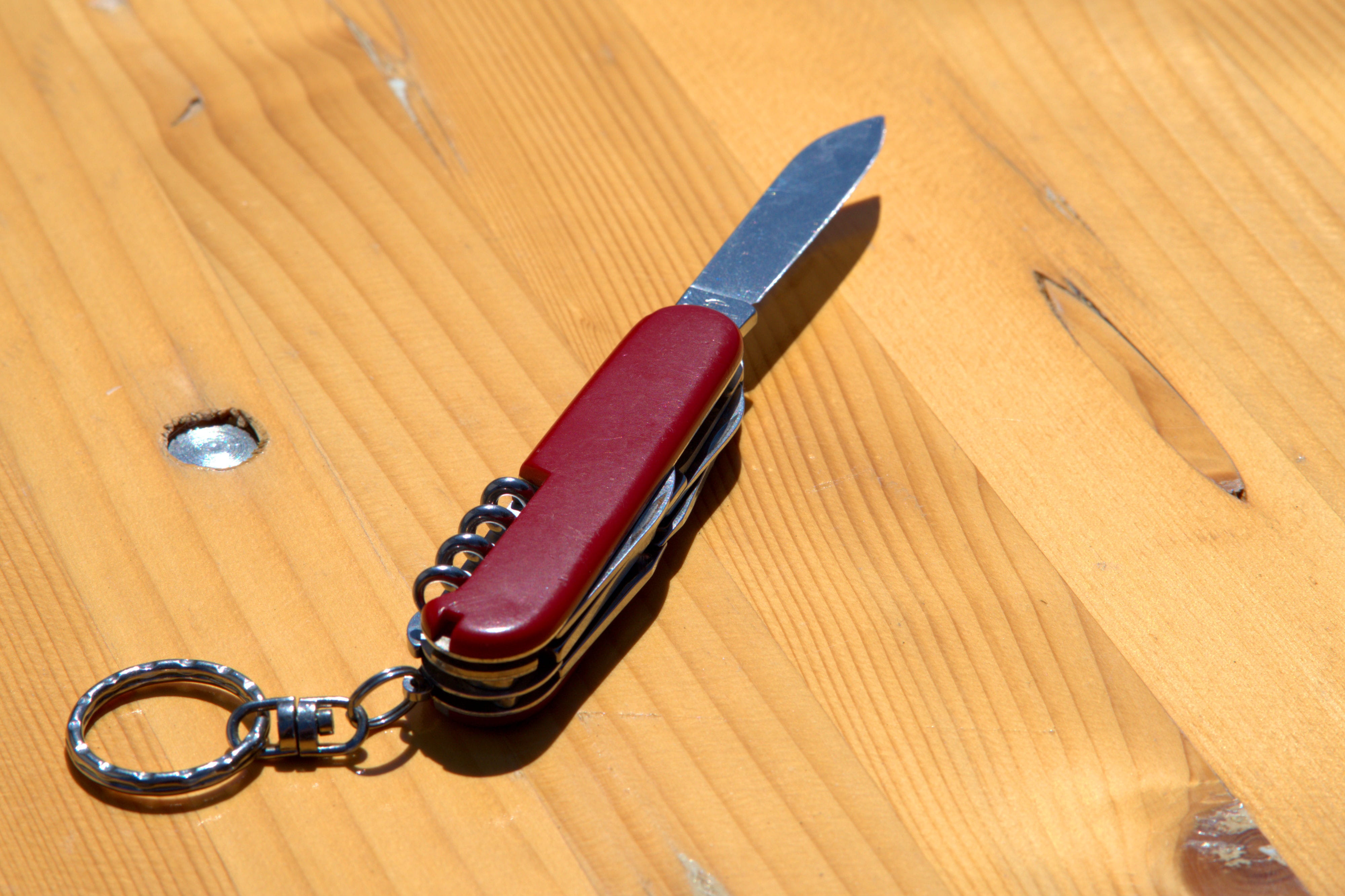 writing instrument, red, swiss, knife, 4K, high angle view, equipment, work tool, cut, close-up, no people, metal, still life, wood grain, container, man made, HD Wallpaper