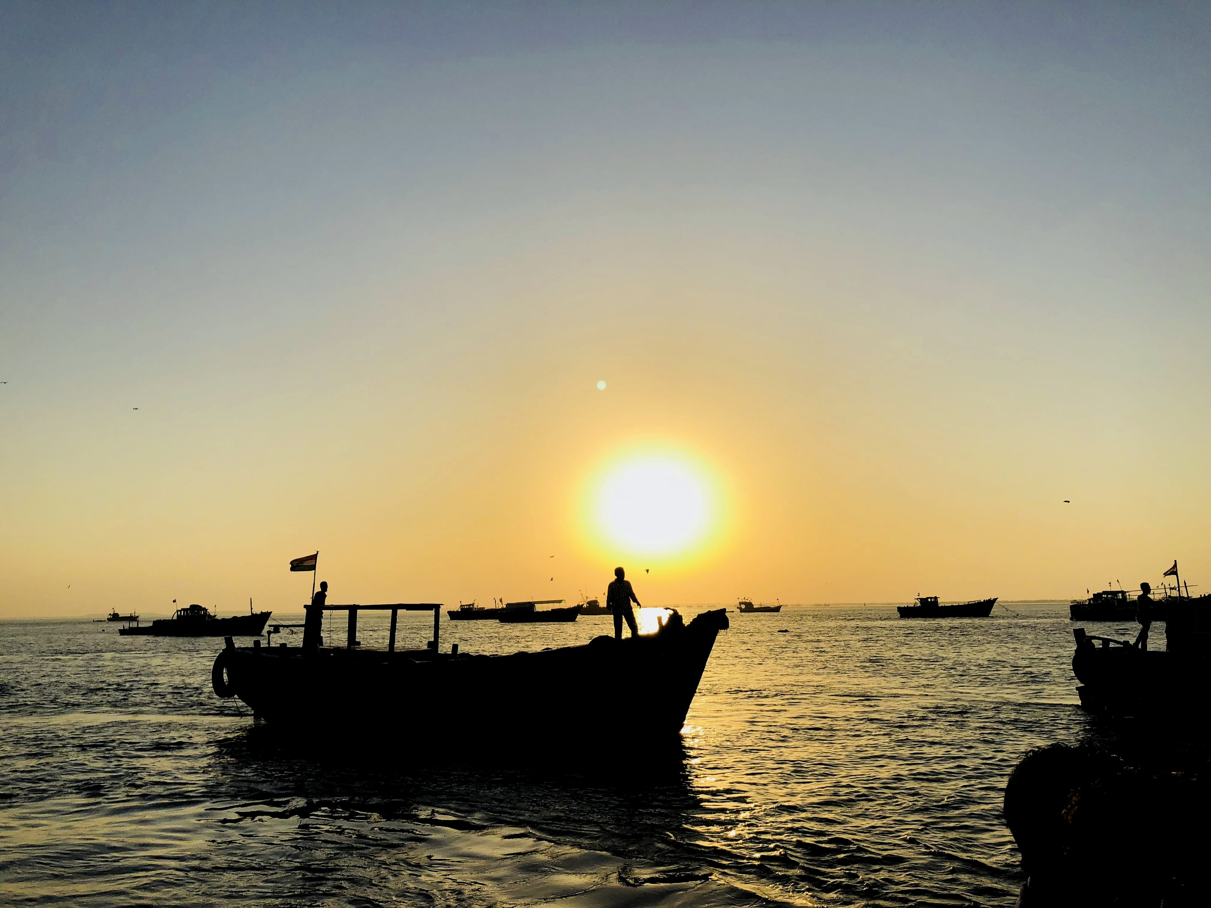sunset, sea, fisherman, haji kirmani rd, awesome, real people, sky, beyt dwarka, outdoors, colors, water, sun, waterfront, silhouette, landscape, scenics - nature, HD Wallpaper