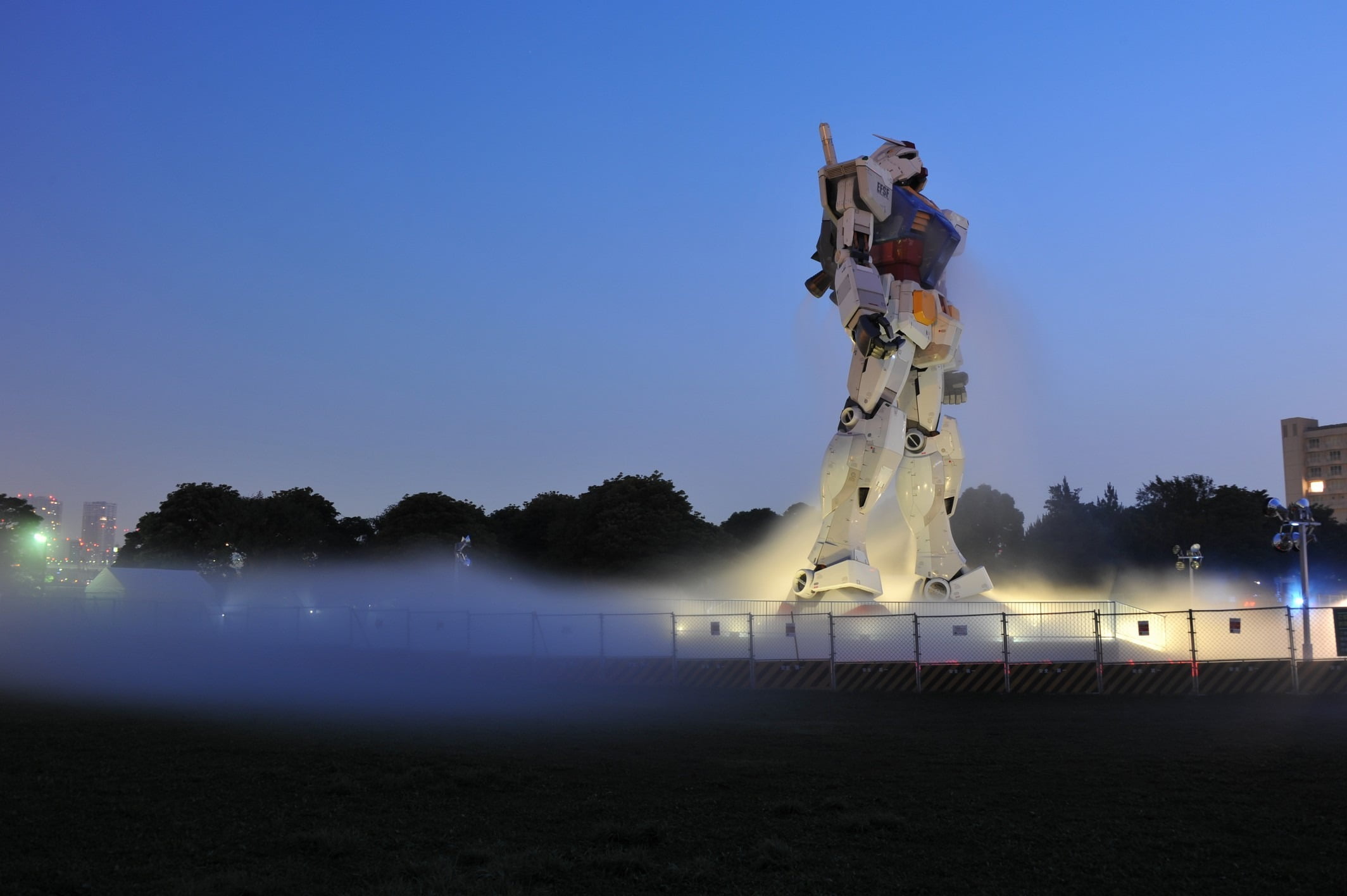 illuminated, outdoors, sky, clear sky, water, copy space, architecture, nature, plant, travel destinations, 1080P, gundam, art and craft, statue, representation, HD Wallpaper