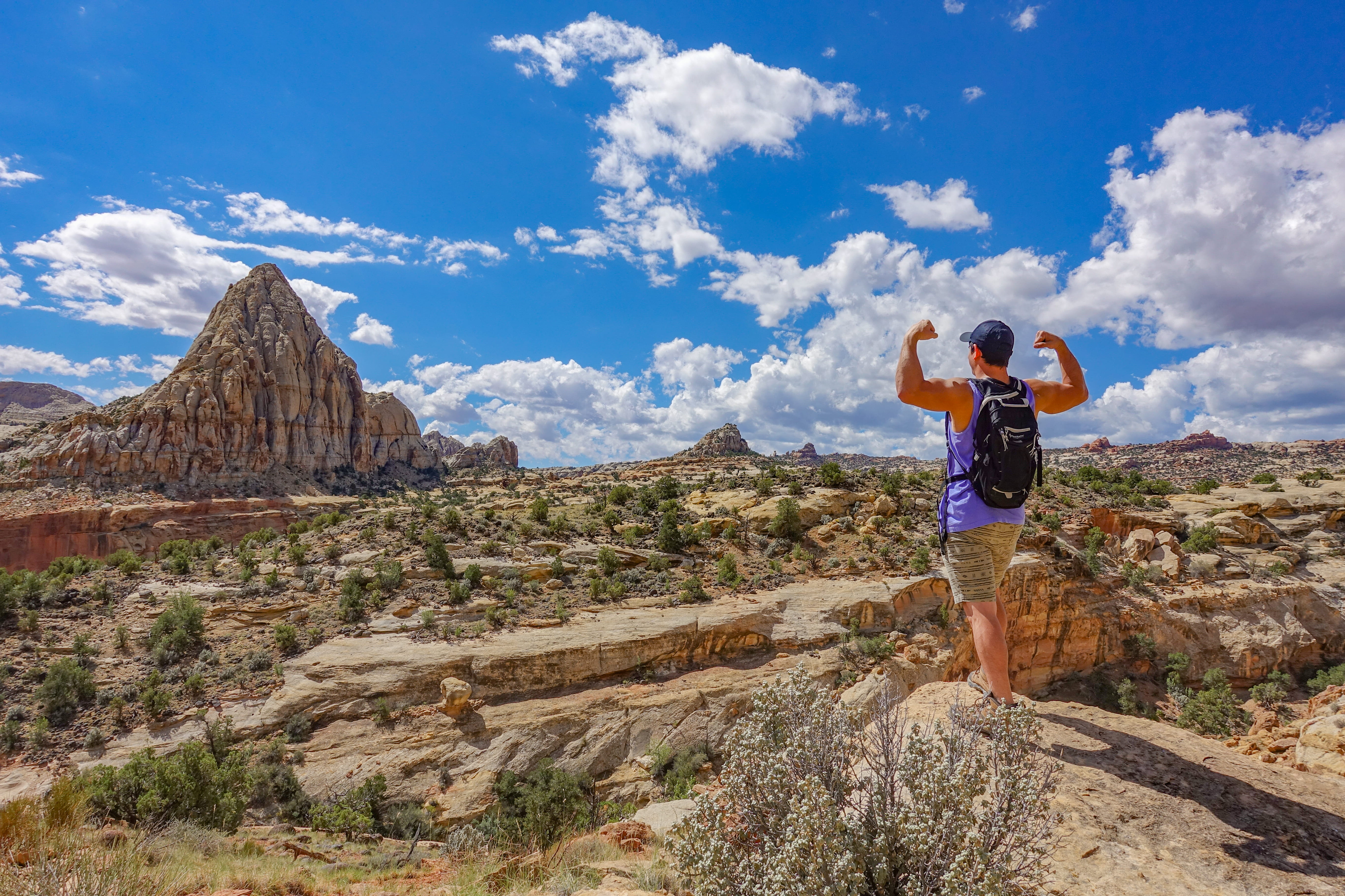 one person, solid, shorts, travel, outdoors, mountain range, sky, leisure activities, united states, clothing, full length, capitol reef national park, HD Wallpaper