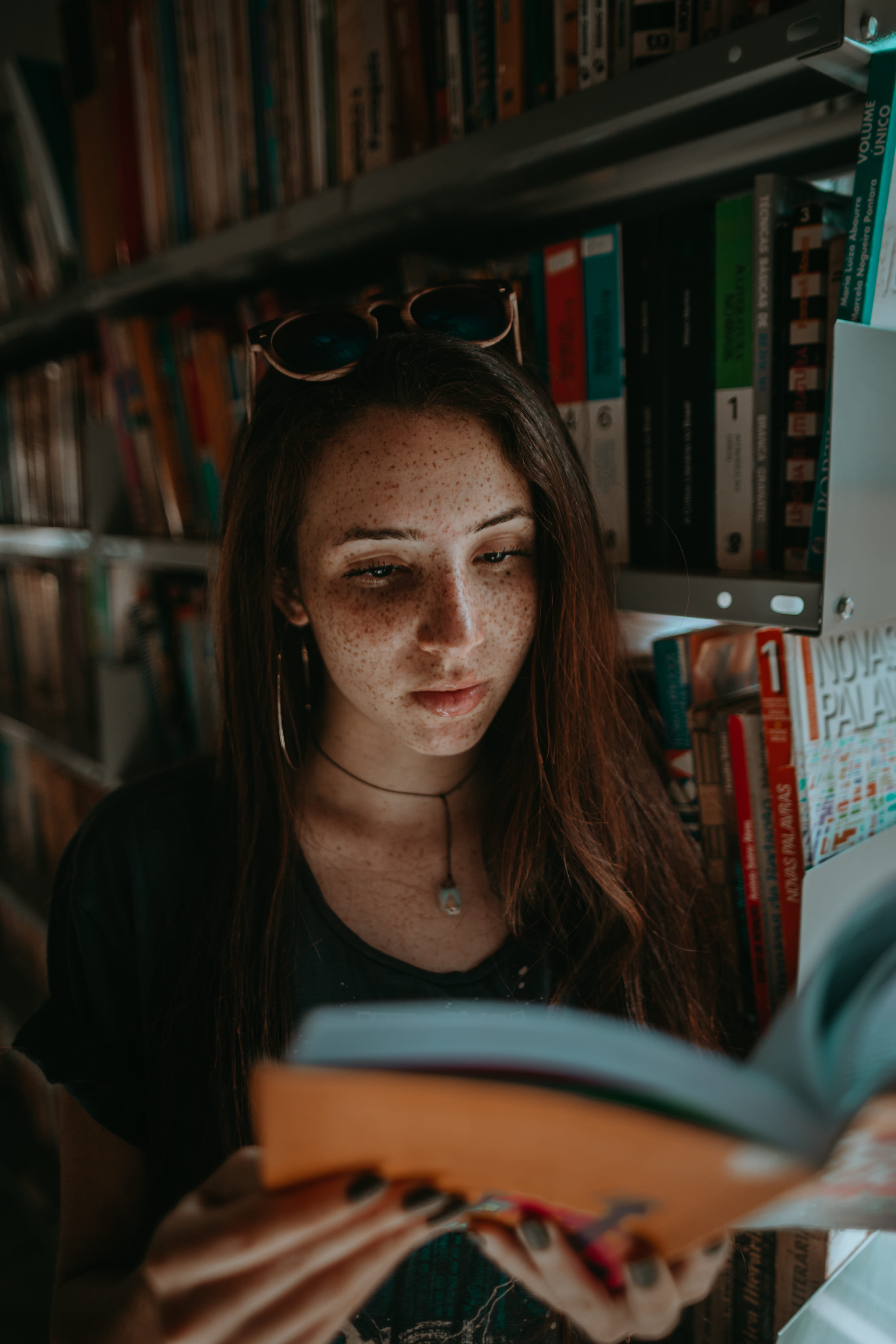 book store, lifestyles, hairstyle, close up, neck, read, one person, orange, speckle, real people, young women, long hair, natural, black, reading, bookshelf, Phone HD Wallpaper