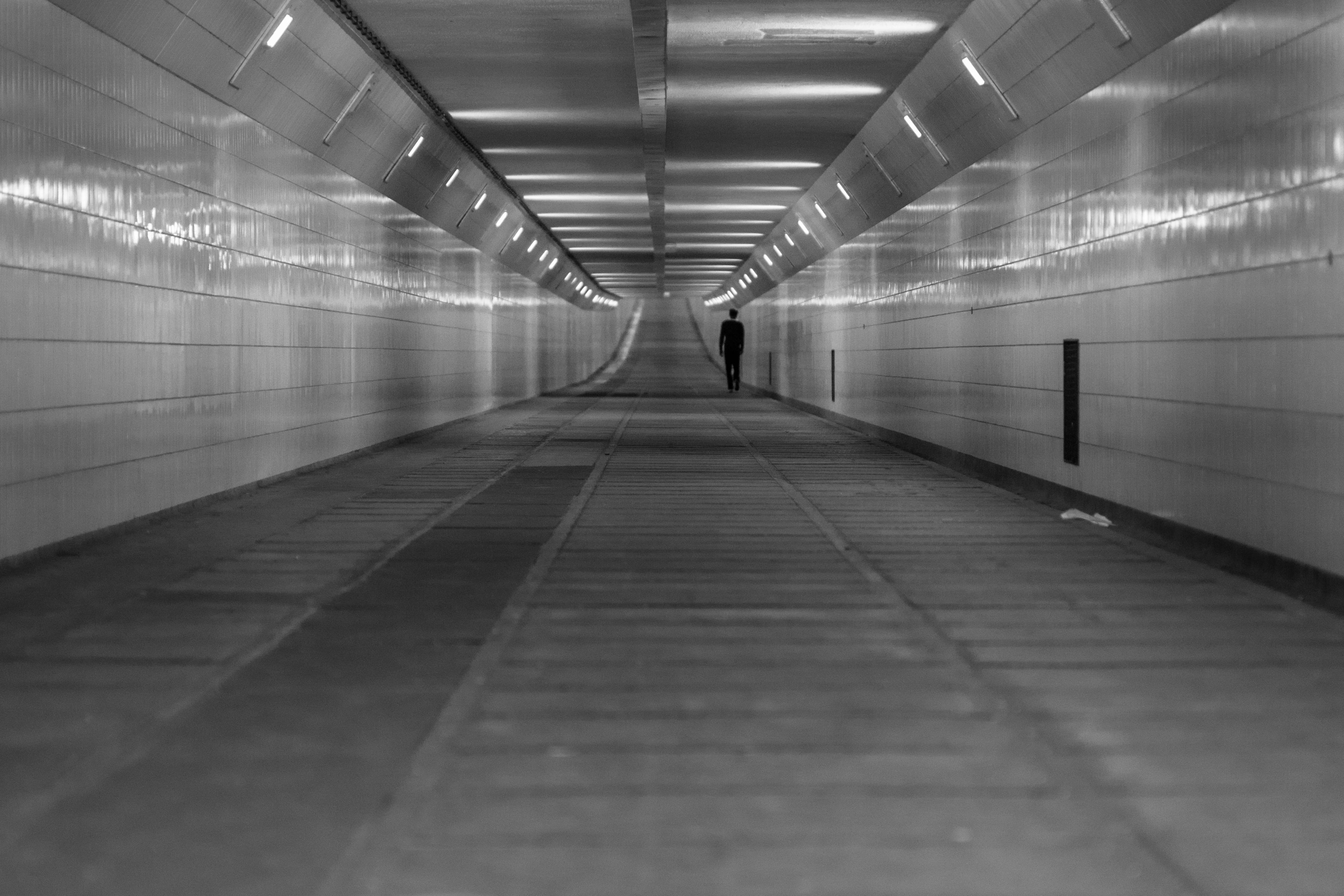 grayscale, indoors, transportation, wall - building feature, subway, real people, walking, diminishing perspective, flooring, the way forward, one person, HD Wallpaper