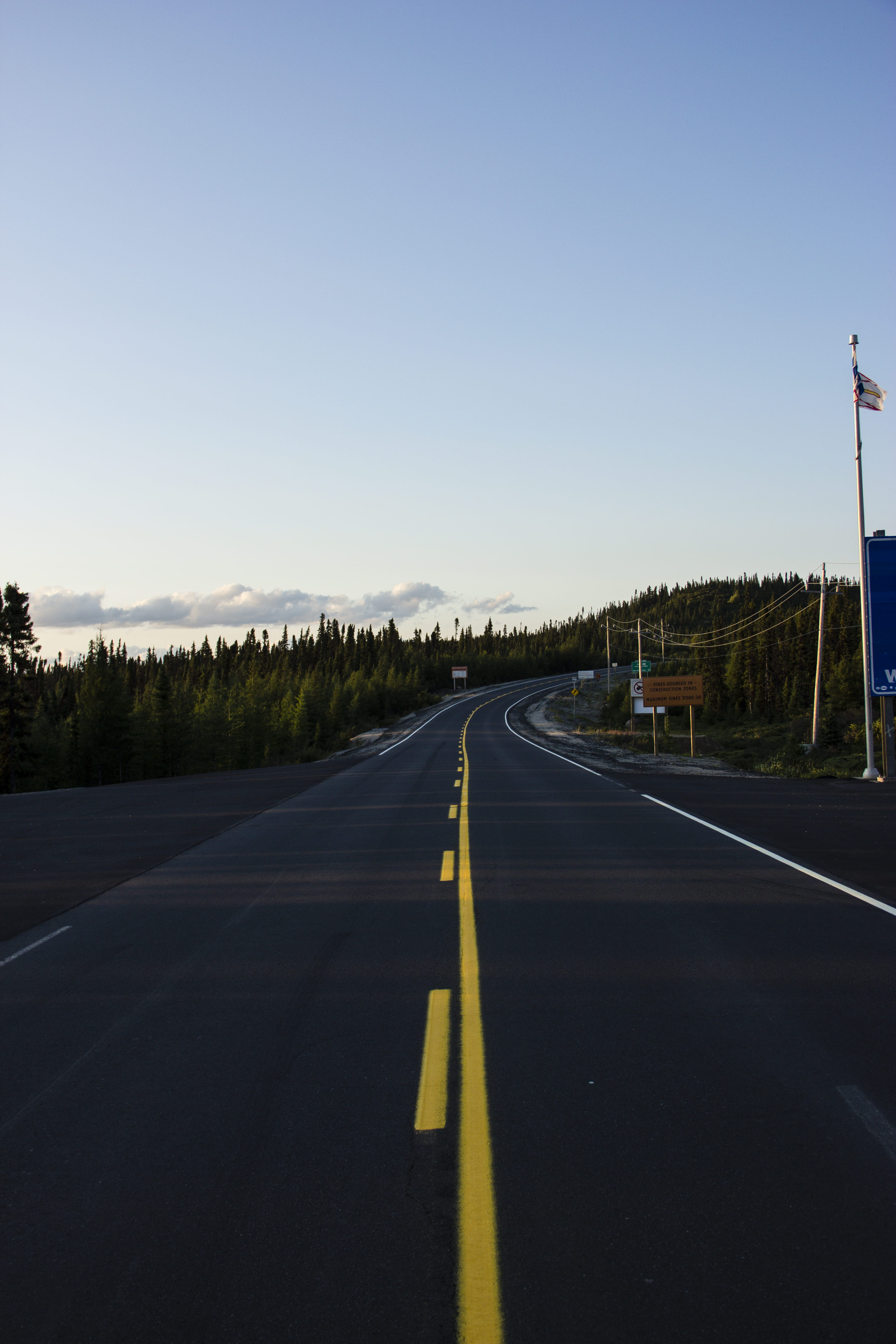 copy space, symbol, transportation, direction, sky, the way forward, day, lake, 5K, tree, asphalt, canada, vanishing point, labrador, marking, road marking, Phone HD Wallpaper